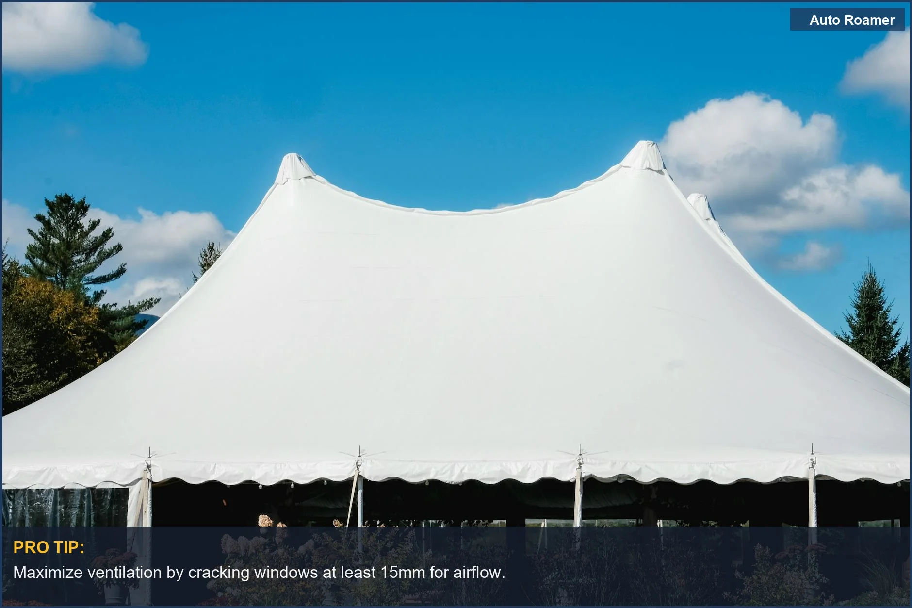 Sleek white tent under blue sky, illustrating car camping condensation challenges.
