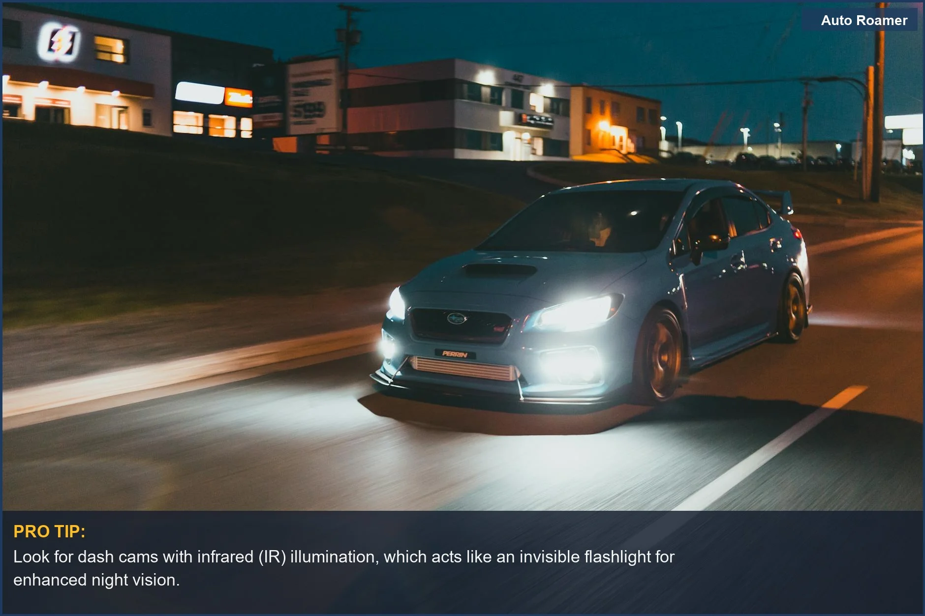 Car headlights illuminate a city street at dusk, showcasing dashcam night vision capabilities in low light conditions.