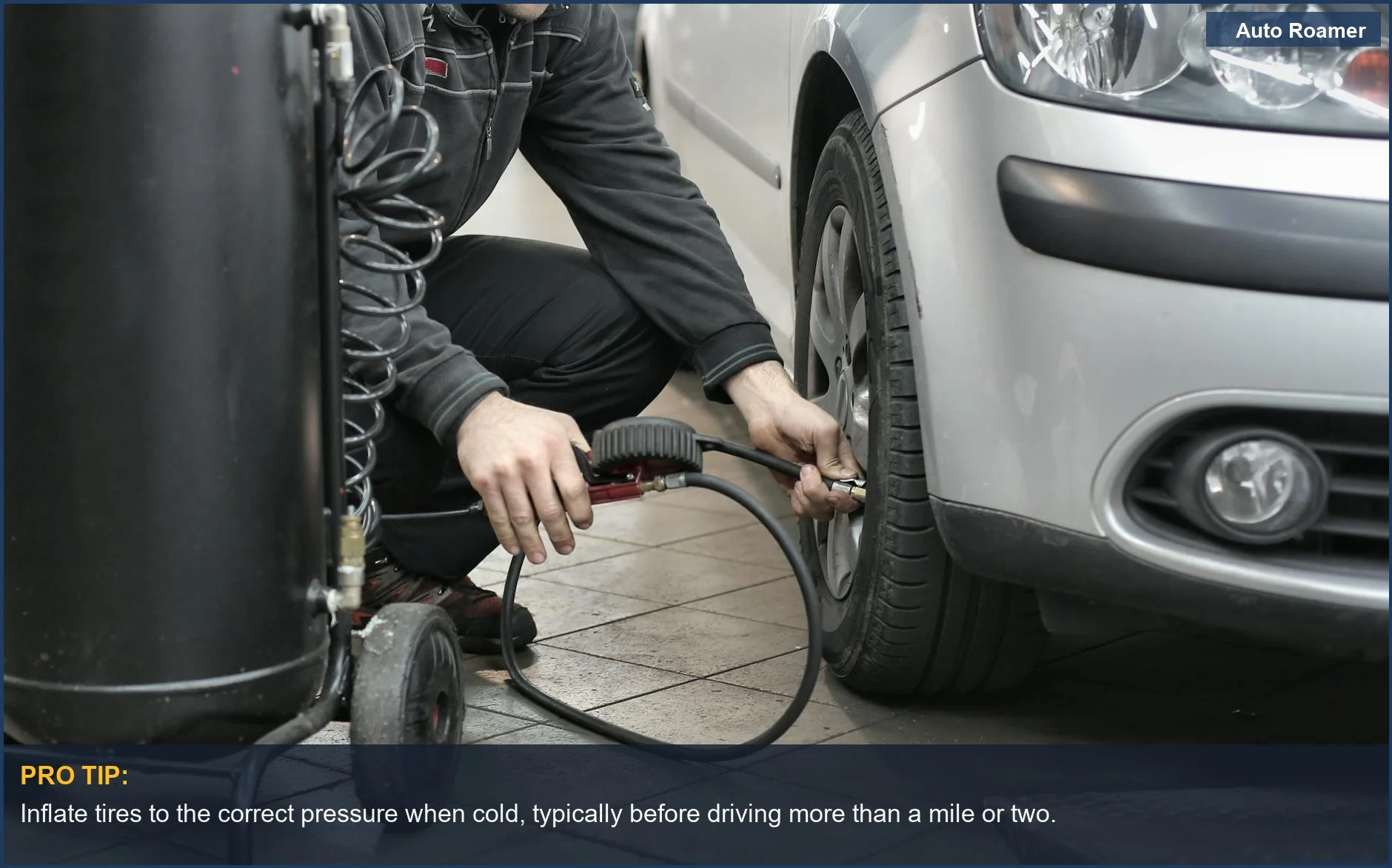 Mechanic checking and adjusting tire pressure on a car in an auto repair shop, highlighting tire pressure alerts.