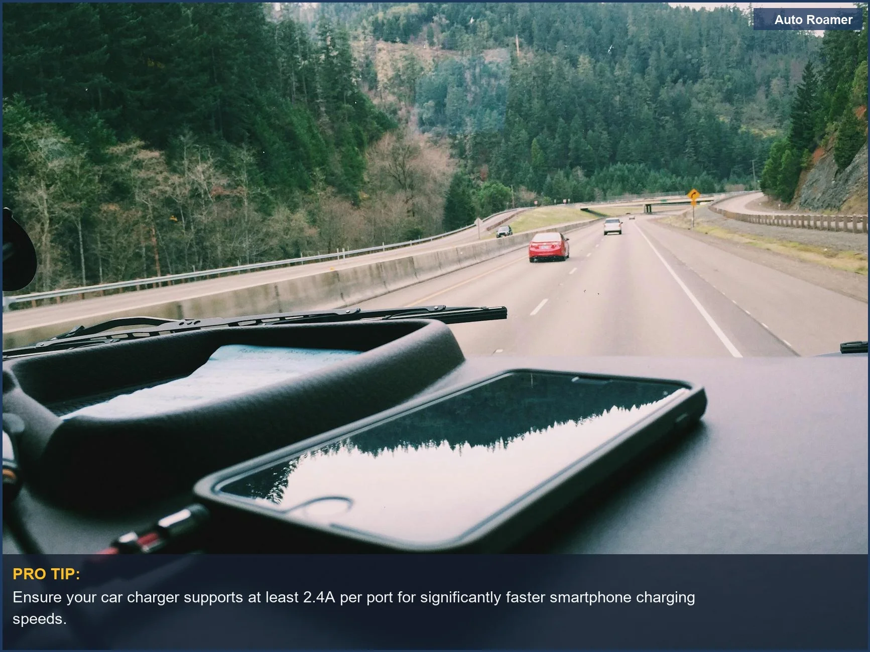 Smartphone charging on car dashboard during a scenic road trip, illustrating fast USB standards for modern vehicles.
