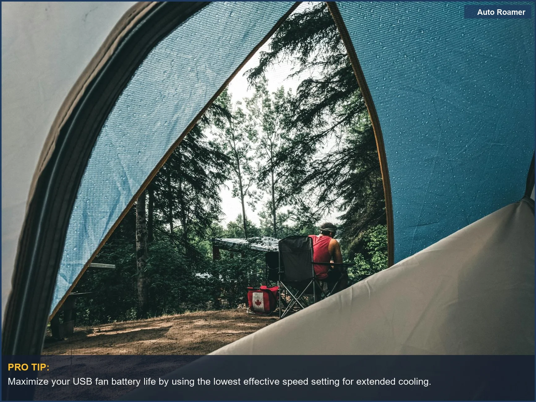 Person relaxing in a tent with a USB rechargeable fan providing airflow on a campsite.