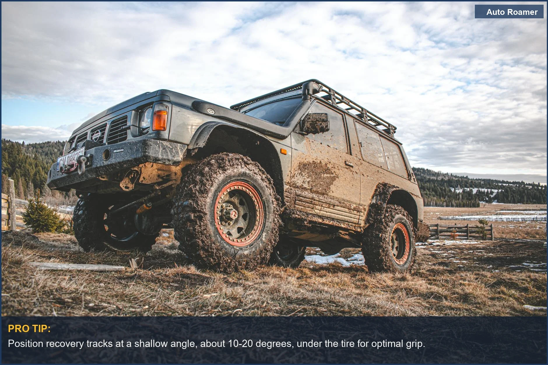 Muddy off-road vehicle demonstrating essential recovery track techniques on rugged terrain.