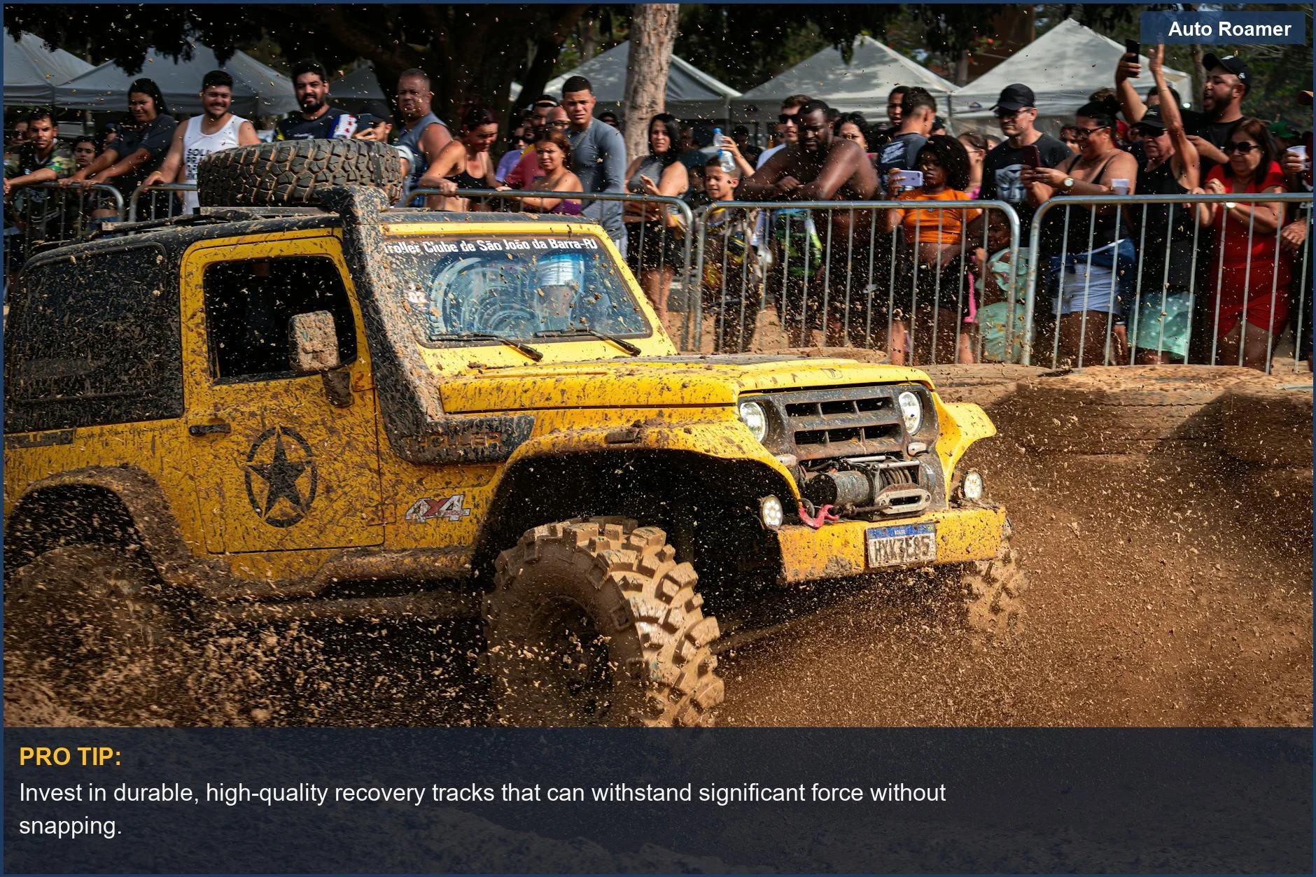 Yellow off-road vehicle splashing through mud, highlighting the need for quality recovery gear.