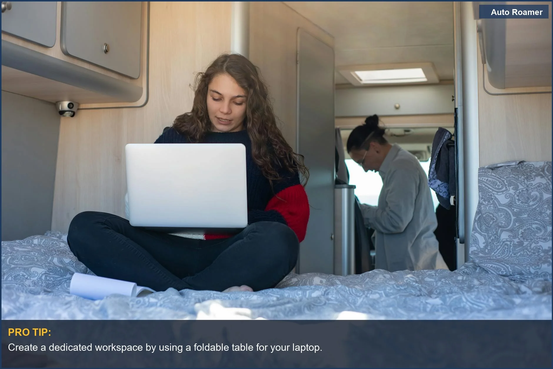 Young woman working on a laptop inside a Volkswagen California camper van, showcasing mobile lifestyle convenience.
