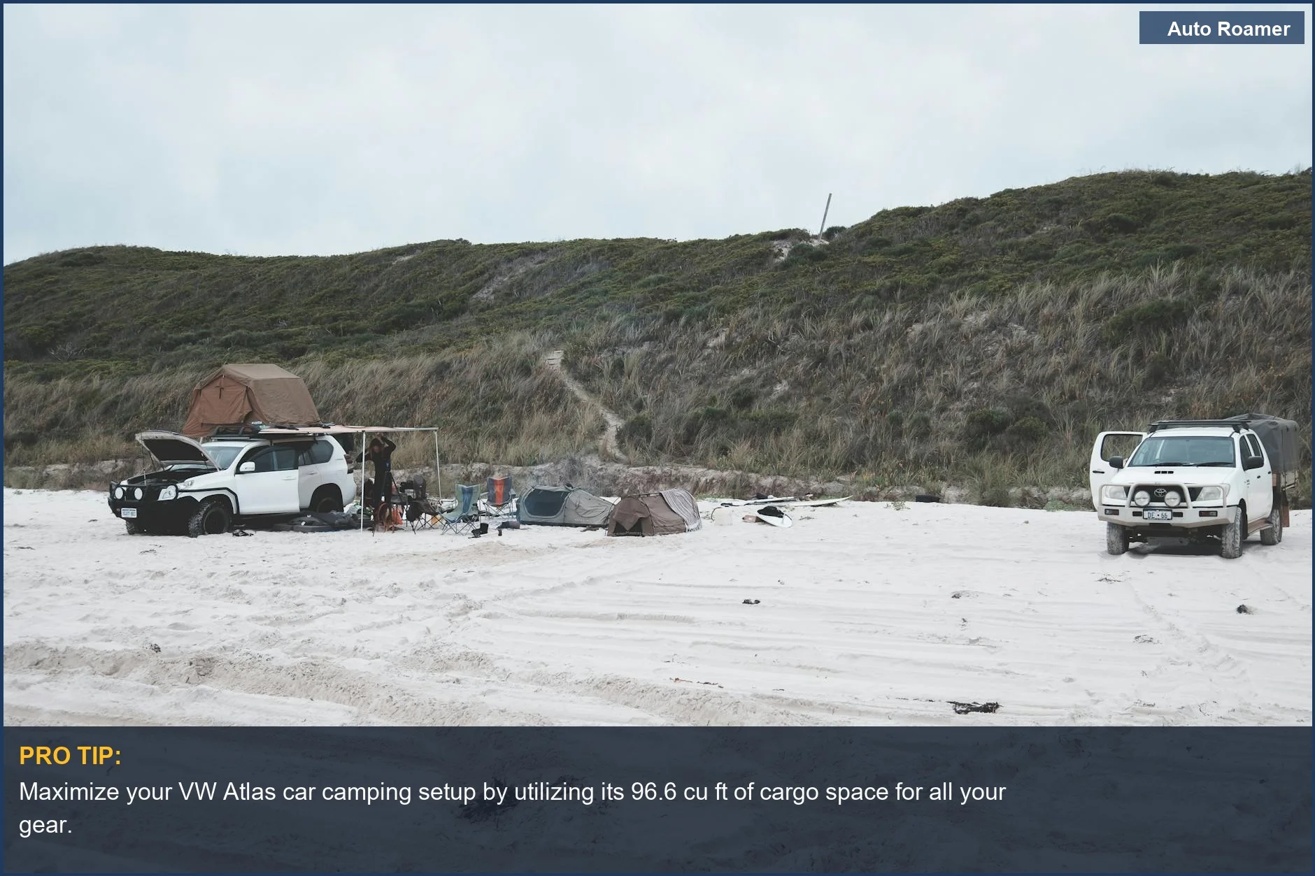 VW Atlas car camping at a peaceful beach campsite with SUVs and tents, coastal scenery.