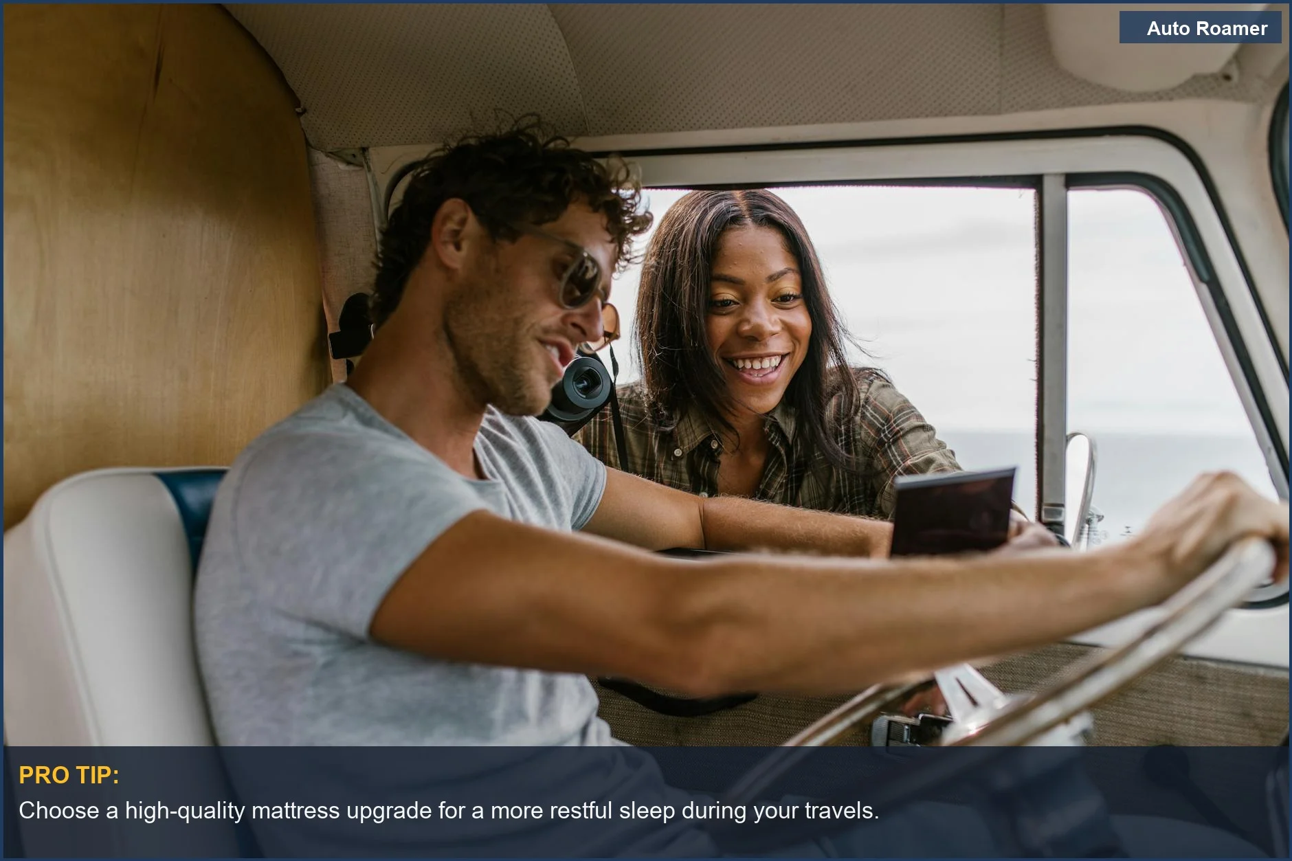 Cheerful couple relaxing inside a camper van, celebrating their road trip adventure in 2025.
