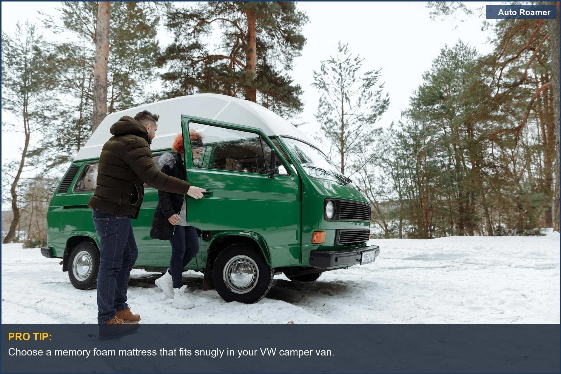 Couple experiencing a winter adventure in a classic green camper van.