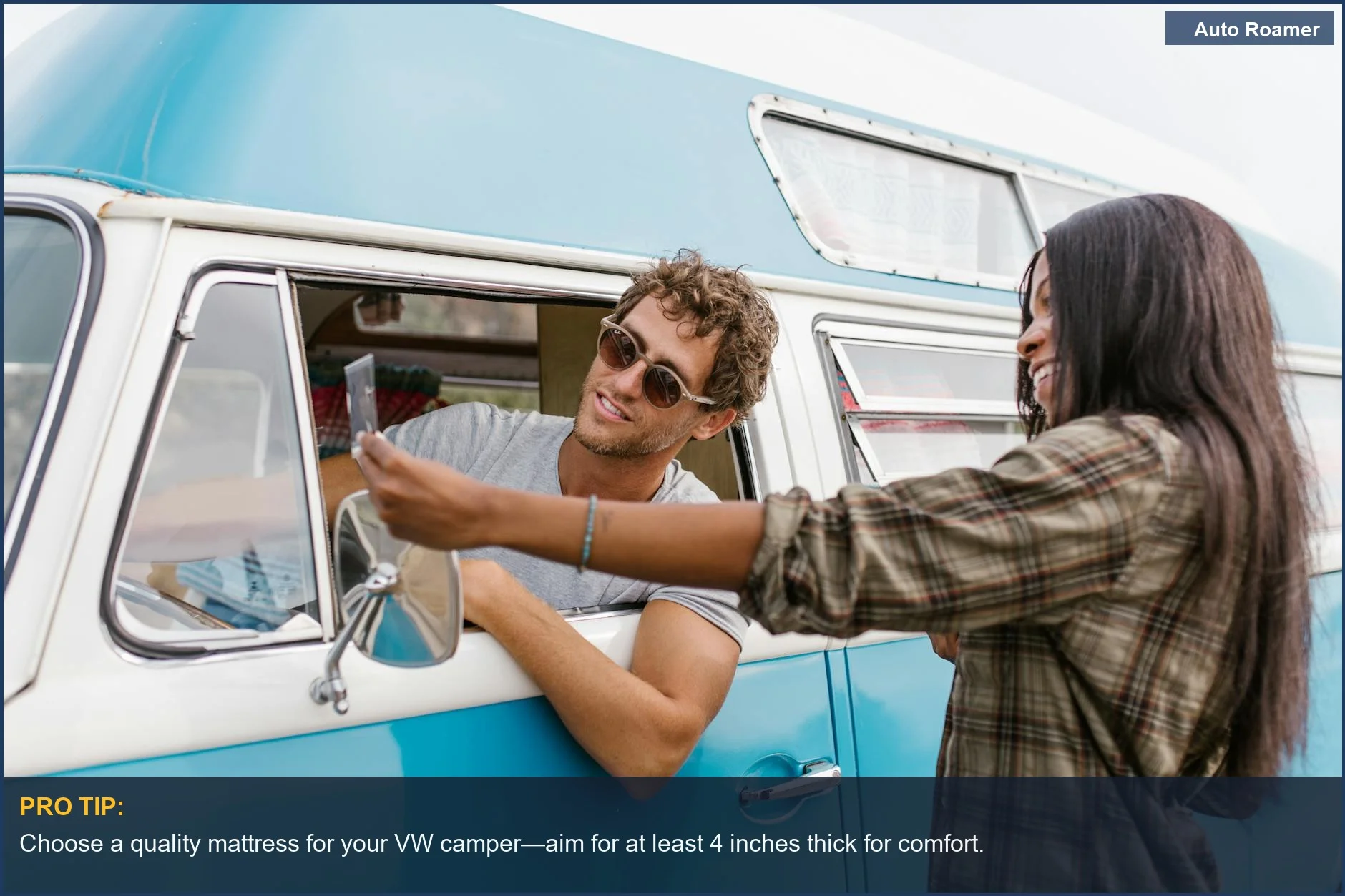 A happy couple enjoying a road trip in a vintage VW camper van, embodying the van life values.