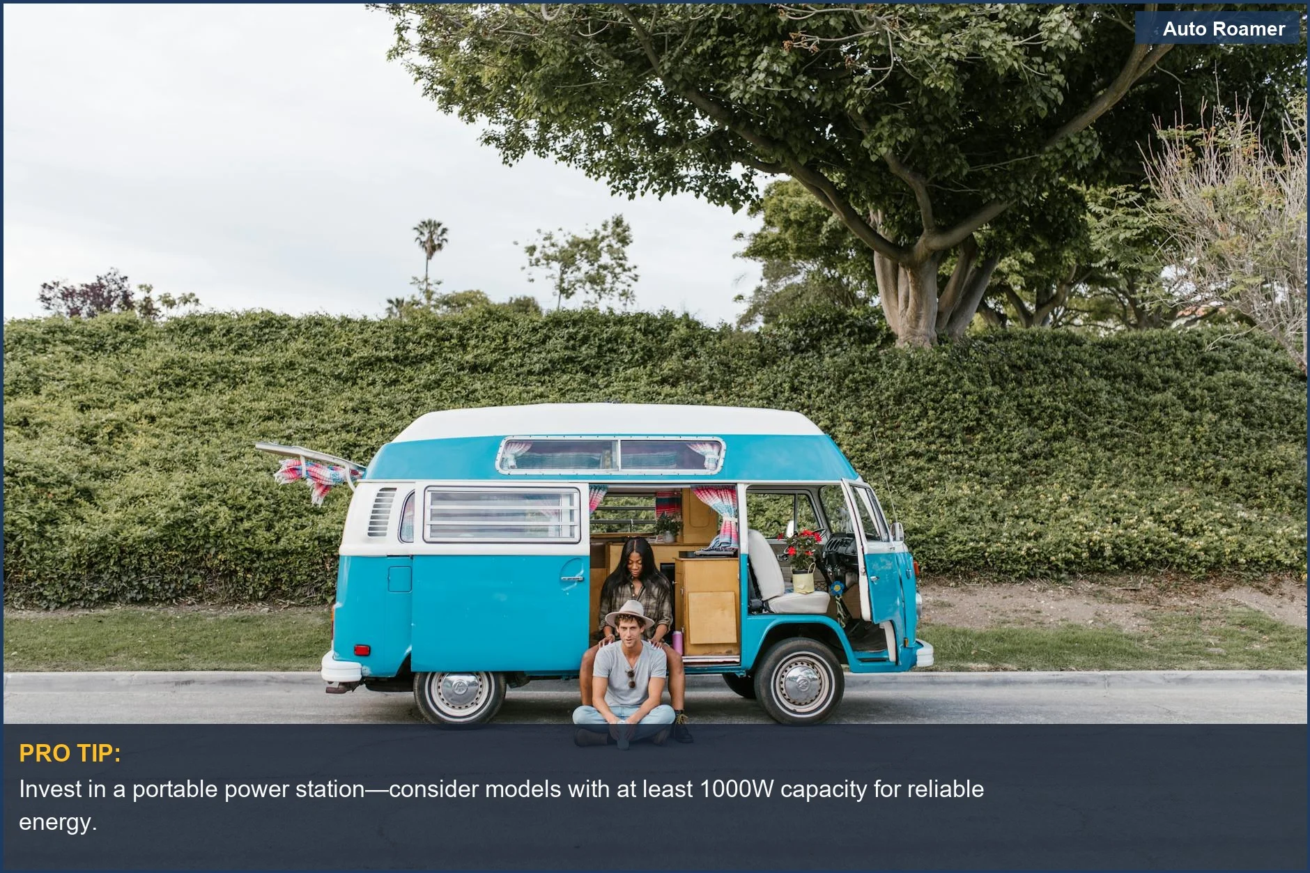 A young couple relaxing by their vintage blue camper van on a summer street, discussing energy solutions.