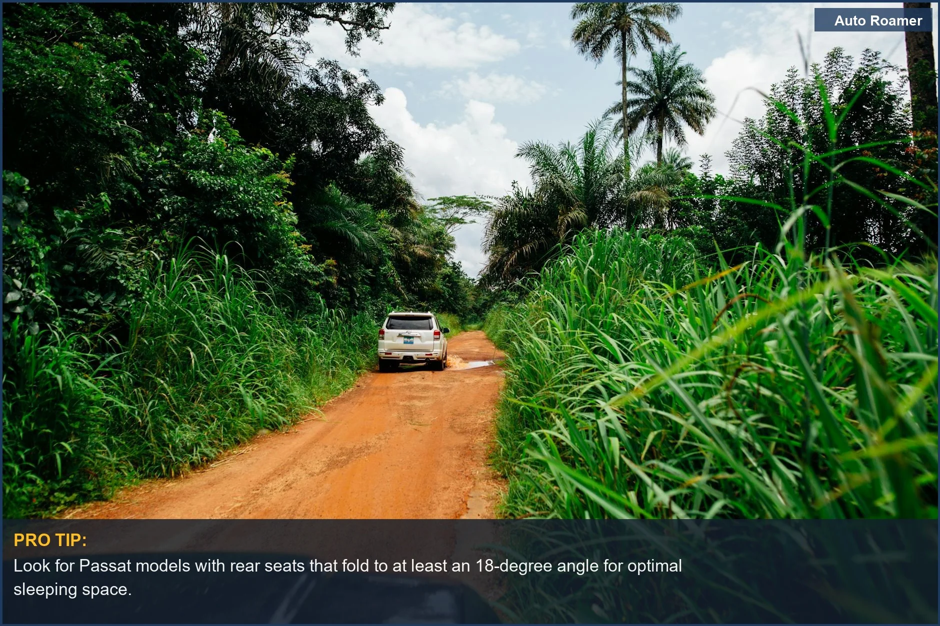 VW Passat car camping SUV navigating a lush, green jungle dirt road, highlighting remote exploration.