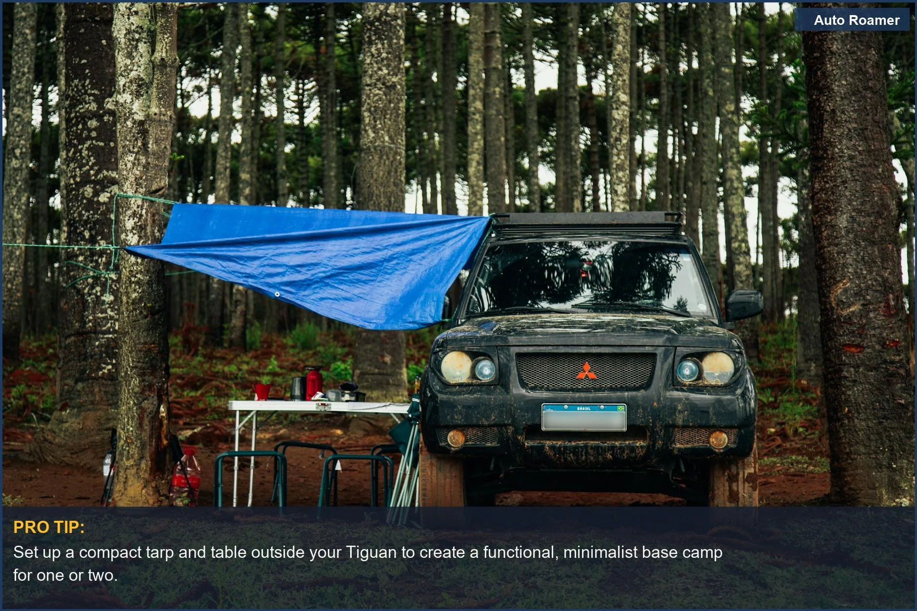 Rugged SUV set up for car camping in a forest clearing with a tarp and table, highlighting Tiguan suitability.