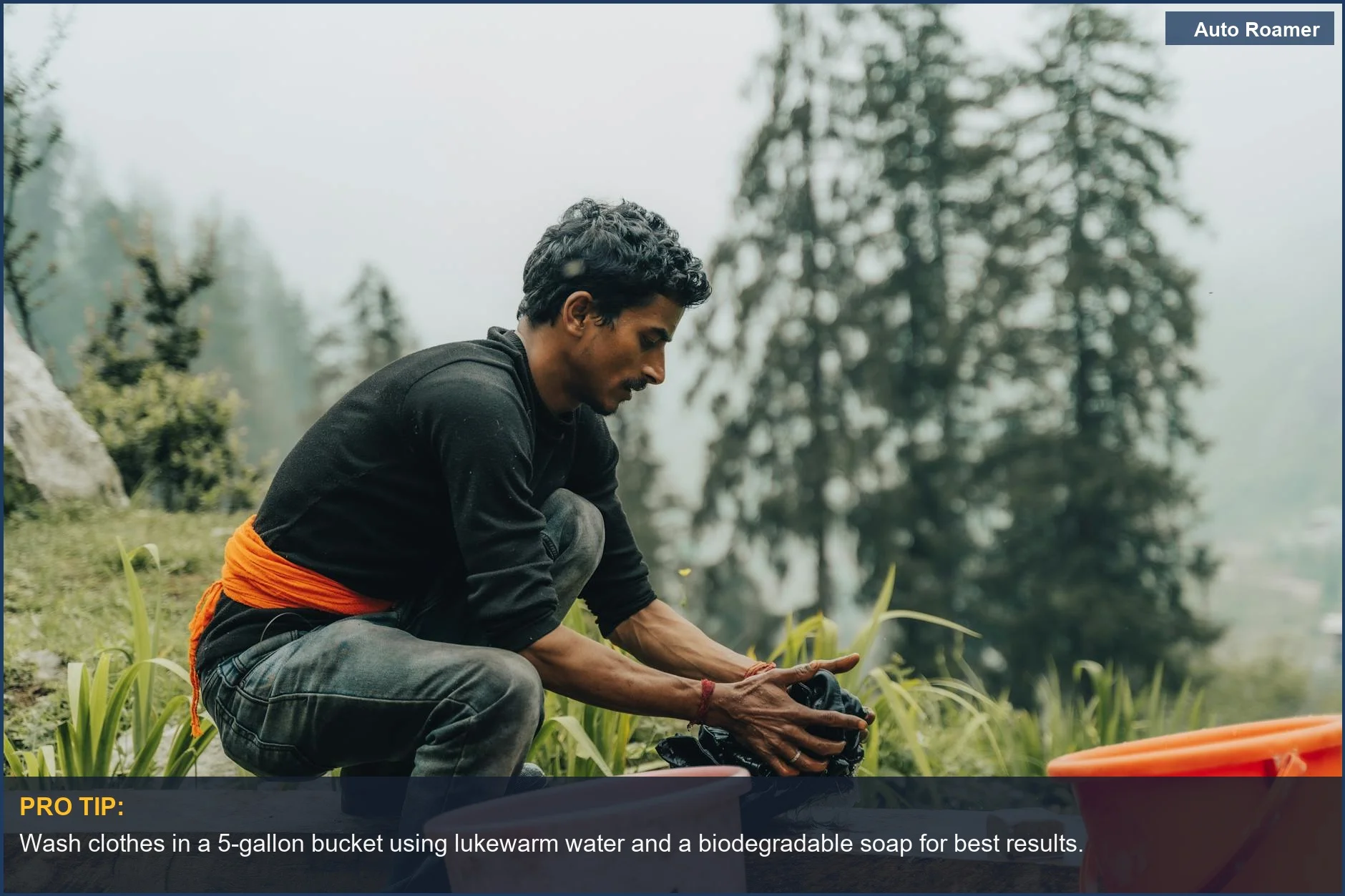 Young man hand washing clothes camping in a forest, a simple and effective car camping laundry method.