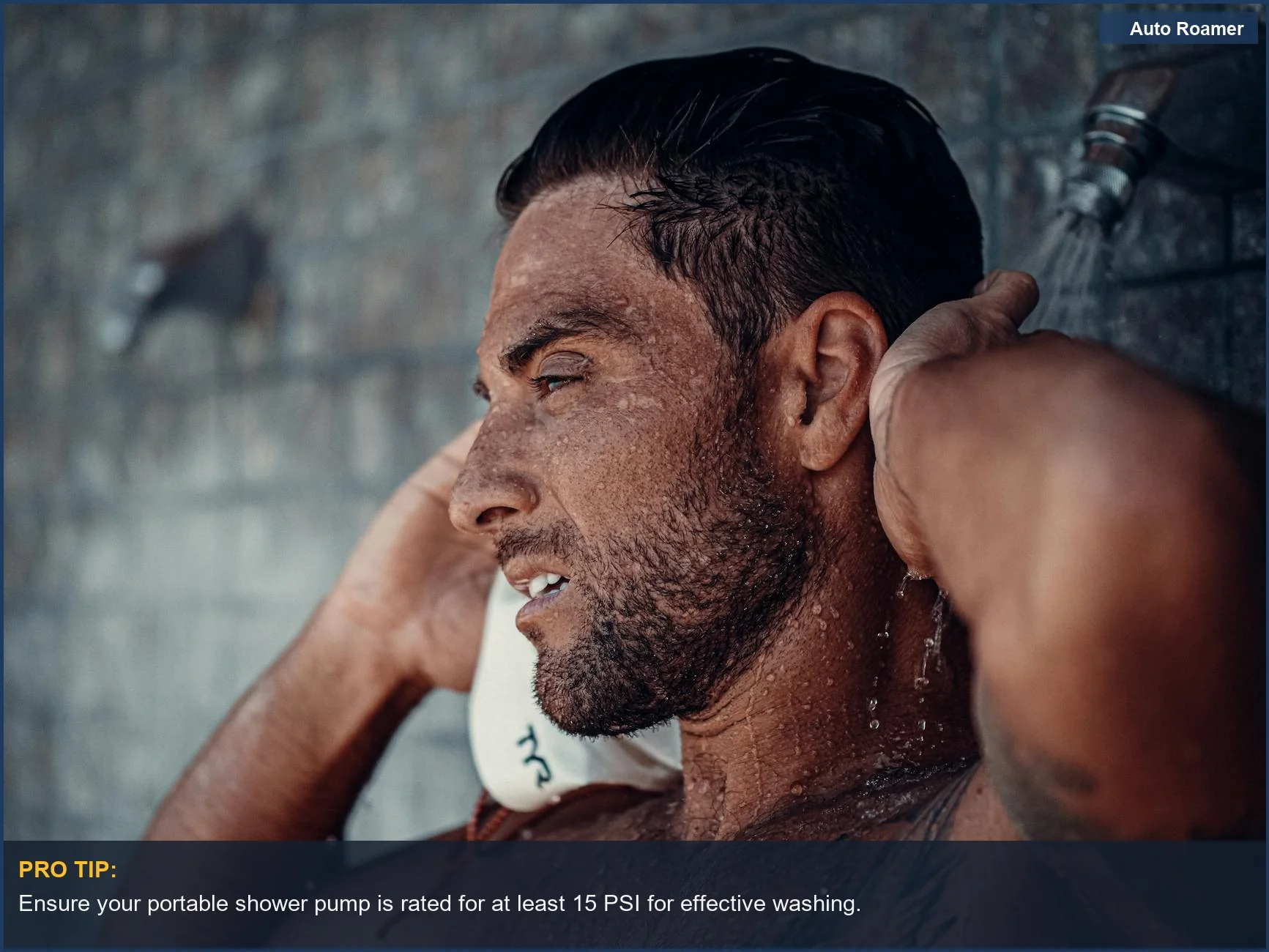 Shirtless man enjoying a refreshing outdoor shower, illustrating the performance of portable camping showers.