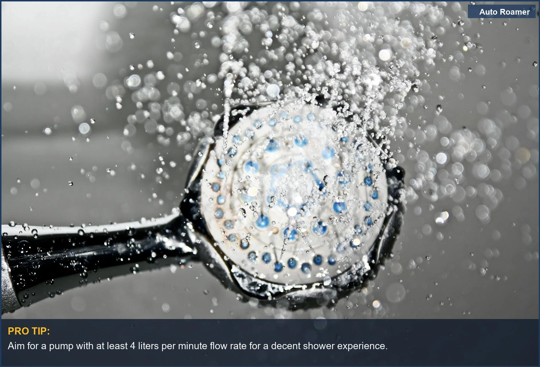 Close-up of a 12v shower head spraying water, demonstrating low water pressure for car camping showers.