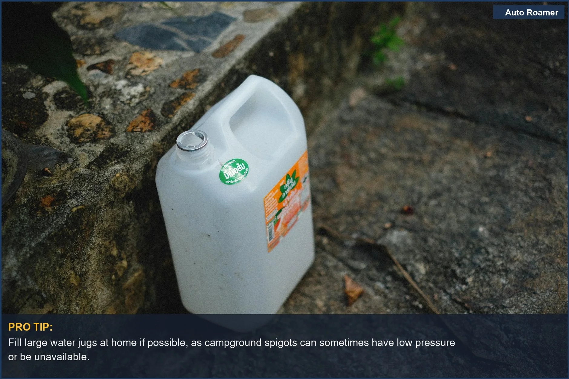 Large white water jug on stone, a common portable shower water source for car camping trips.