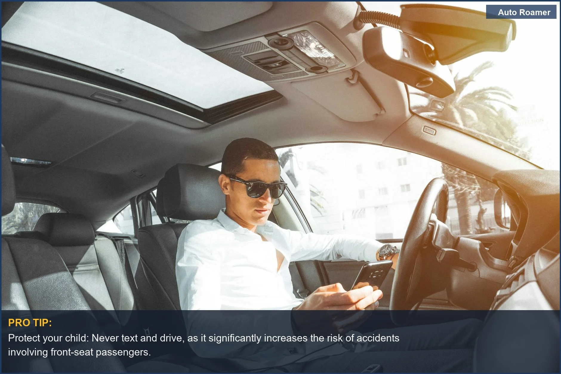 Man texting while driving in Morocco, a stark reminder of the dangers of distracted driving and kids front seat law.