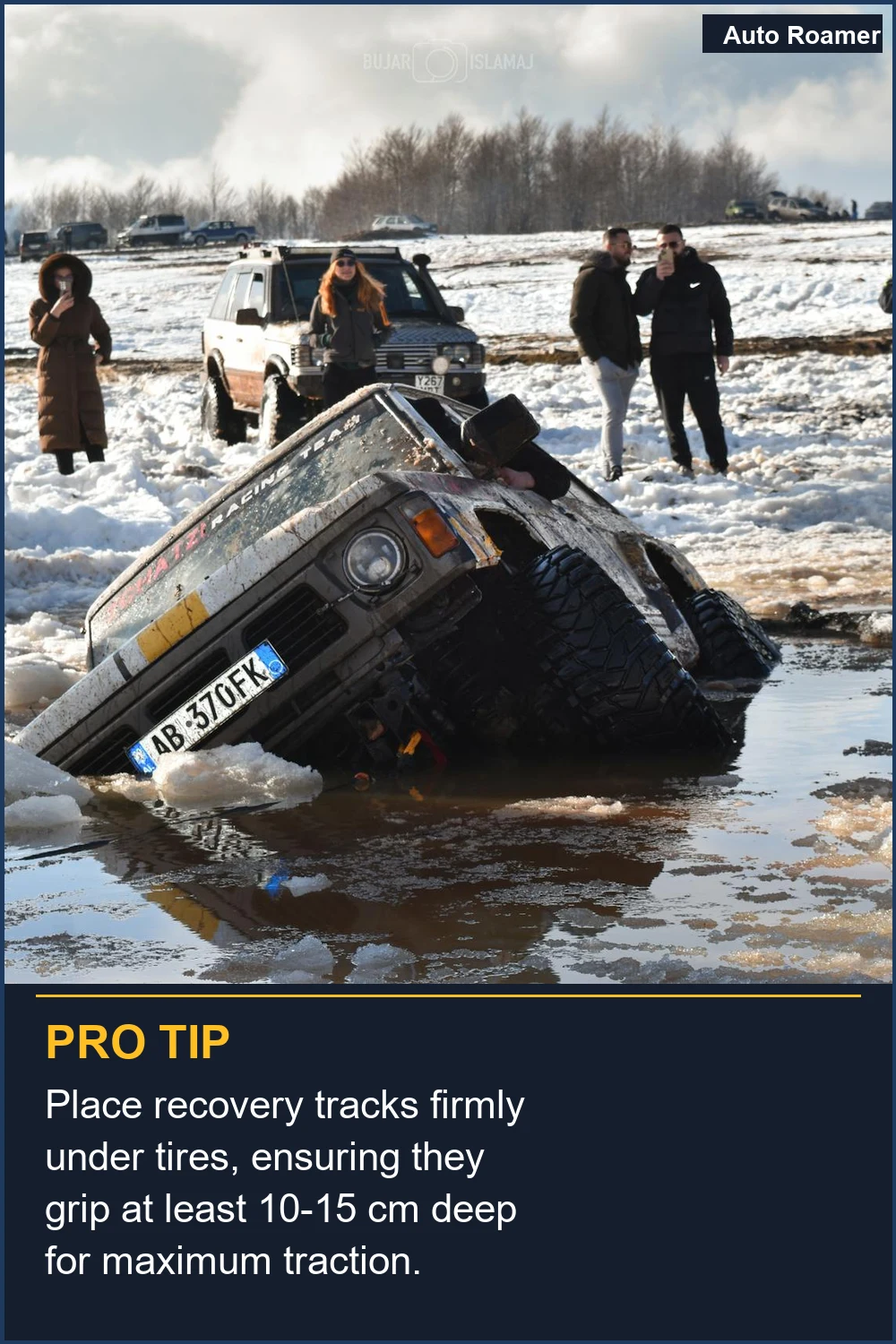 Place recovery tracks firmly under tires, ensuring they grip at least 10-15 cm deep for maximum traction.
