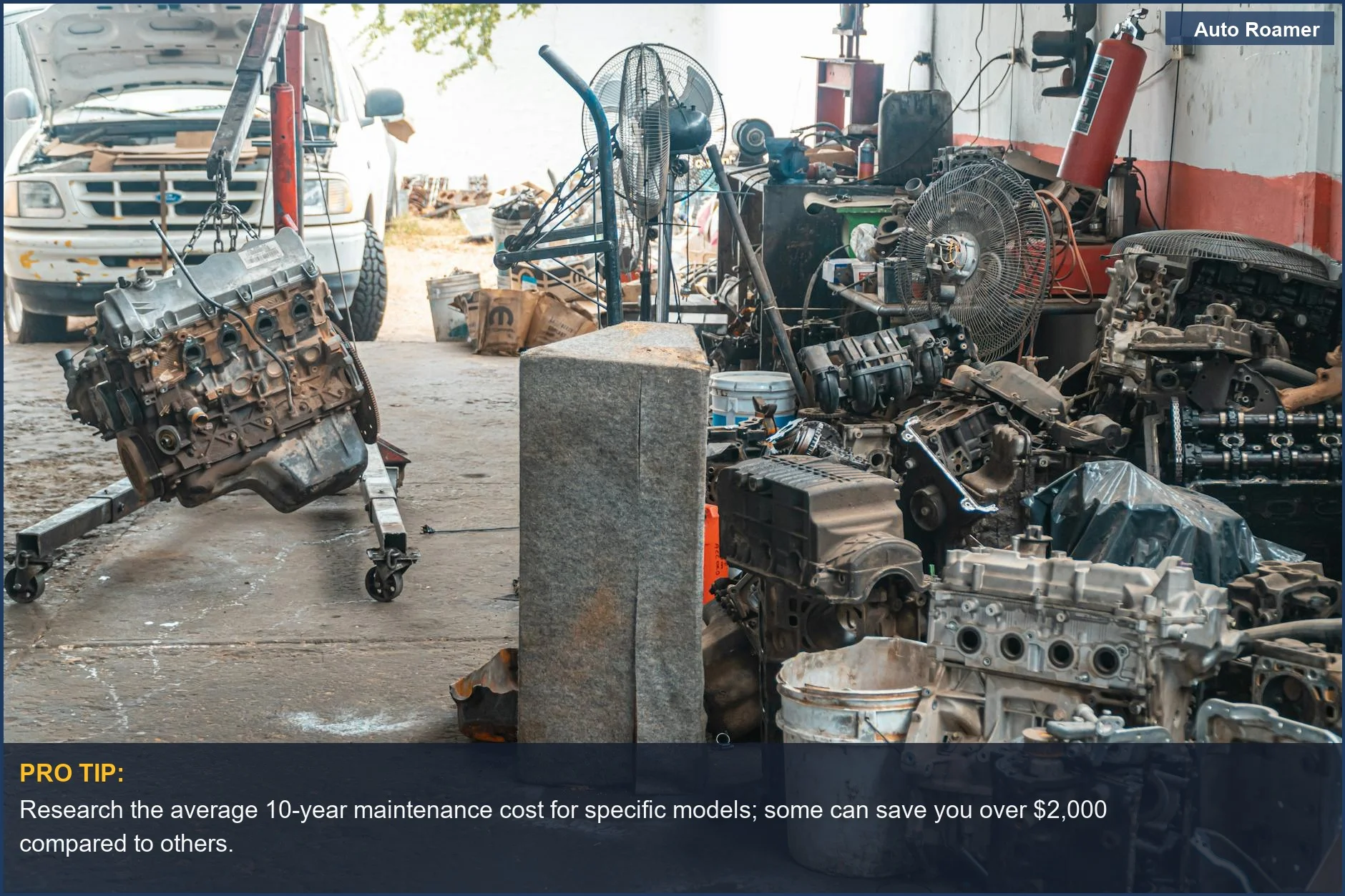 Organized auto workshop displaying engine parts and repair tools, crucial for understanding car maintenance expenses.