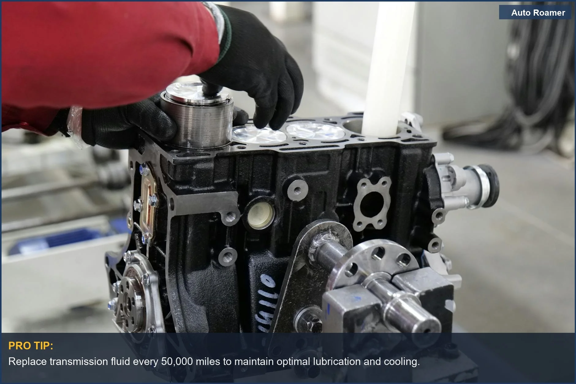 Mechanic meticulously working on a car engine assembly, emphasizing precision in automotive maintenance.