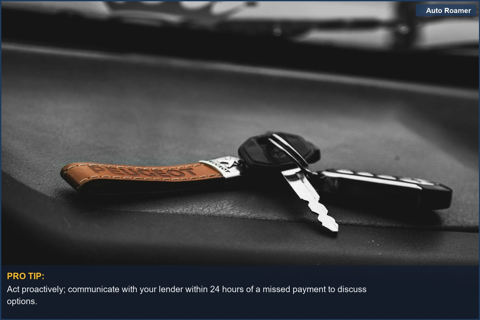 Car key on a black surface with a leather keychain, representing the risk of repossession if you stop paying your car loan.