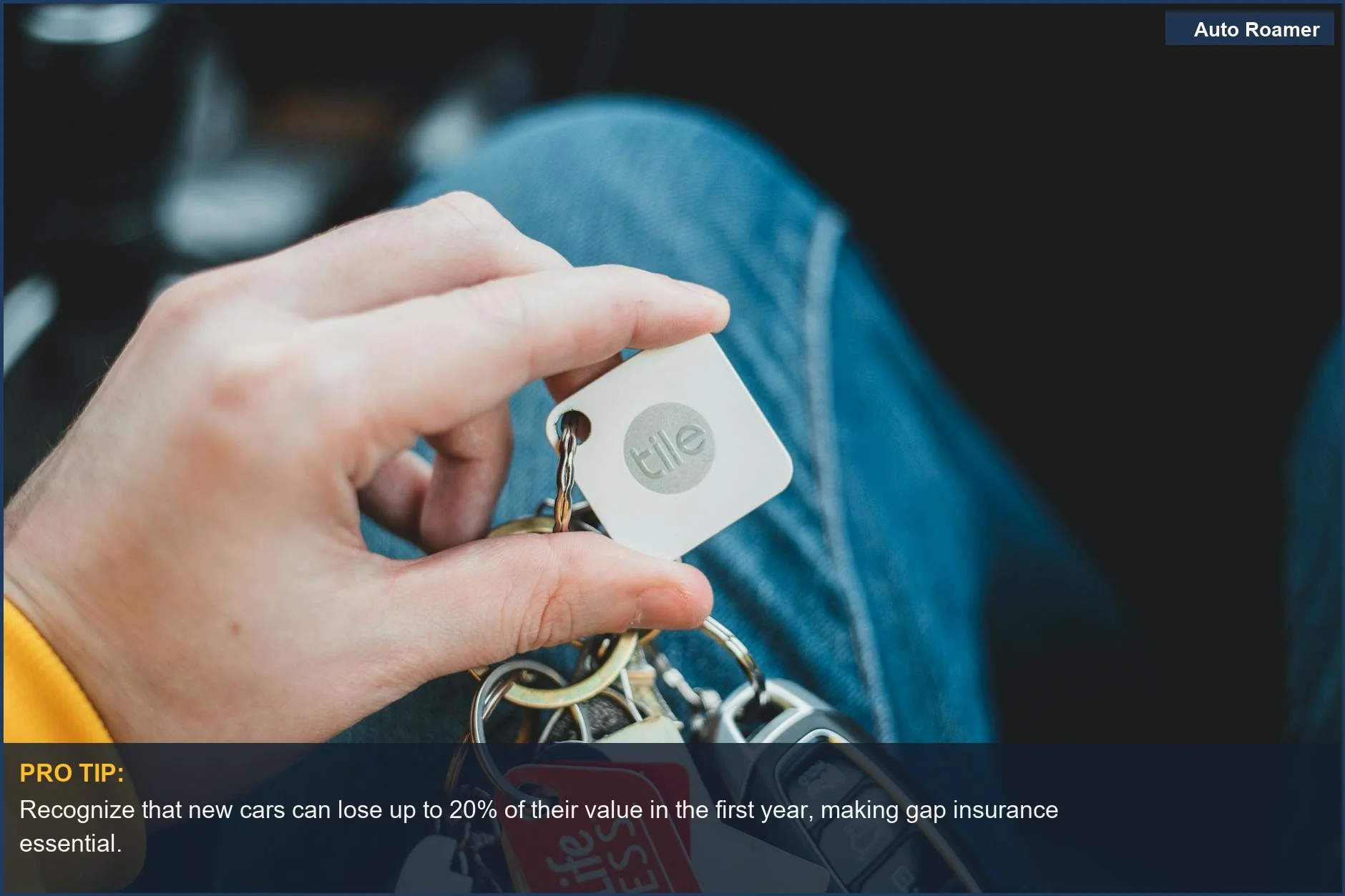 Hand holding car keys with various tags, emphasizing understanding rapid car depreciation and gap insurance needs.