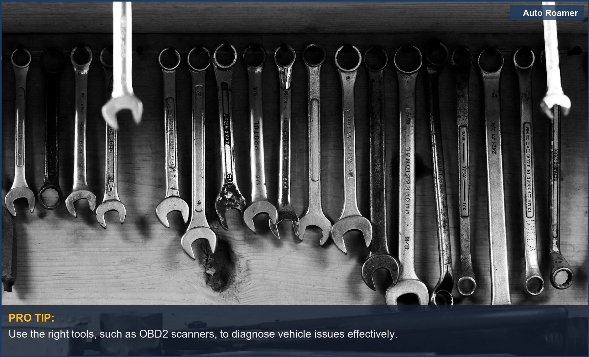 Workshop wall with neatly hung wrenches and tools for car diagnostics.