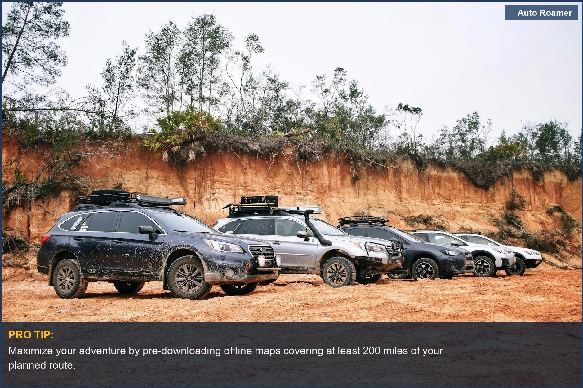 Several SUVs parked on a dusty dirt road, ready for an exciting off-road GPS adventure.