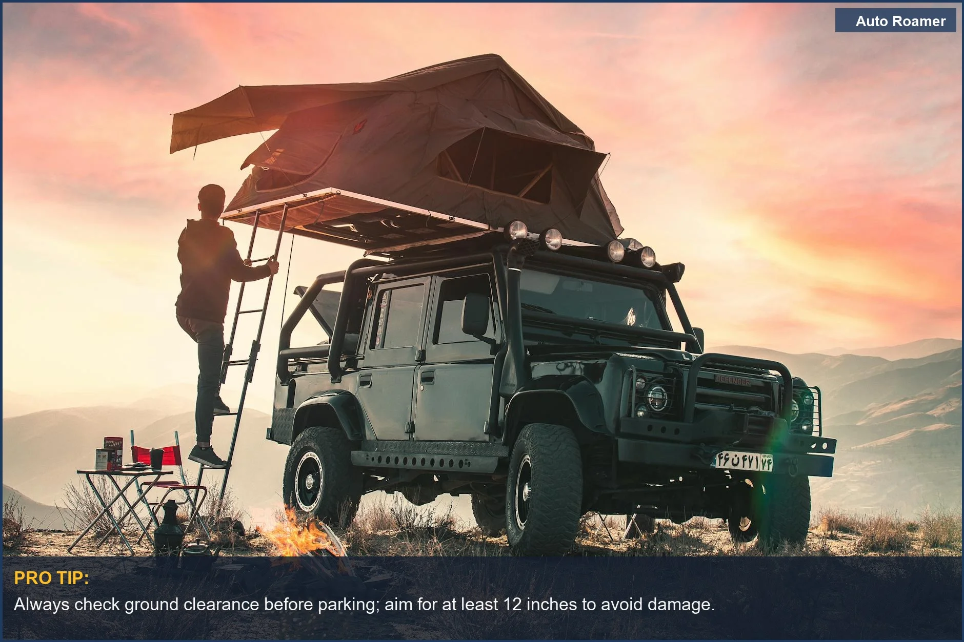 Man climbing stairs to a rooftop tent on an offroader, enjoying mountain sunset views.
