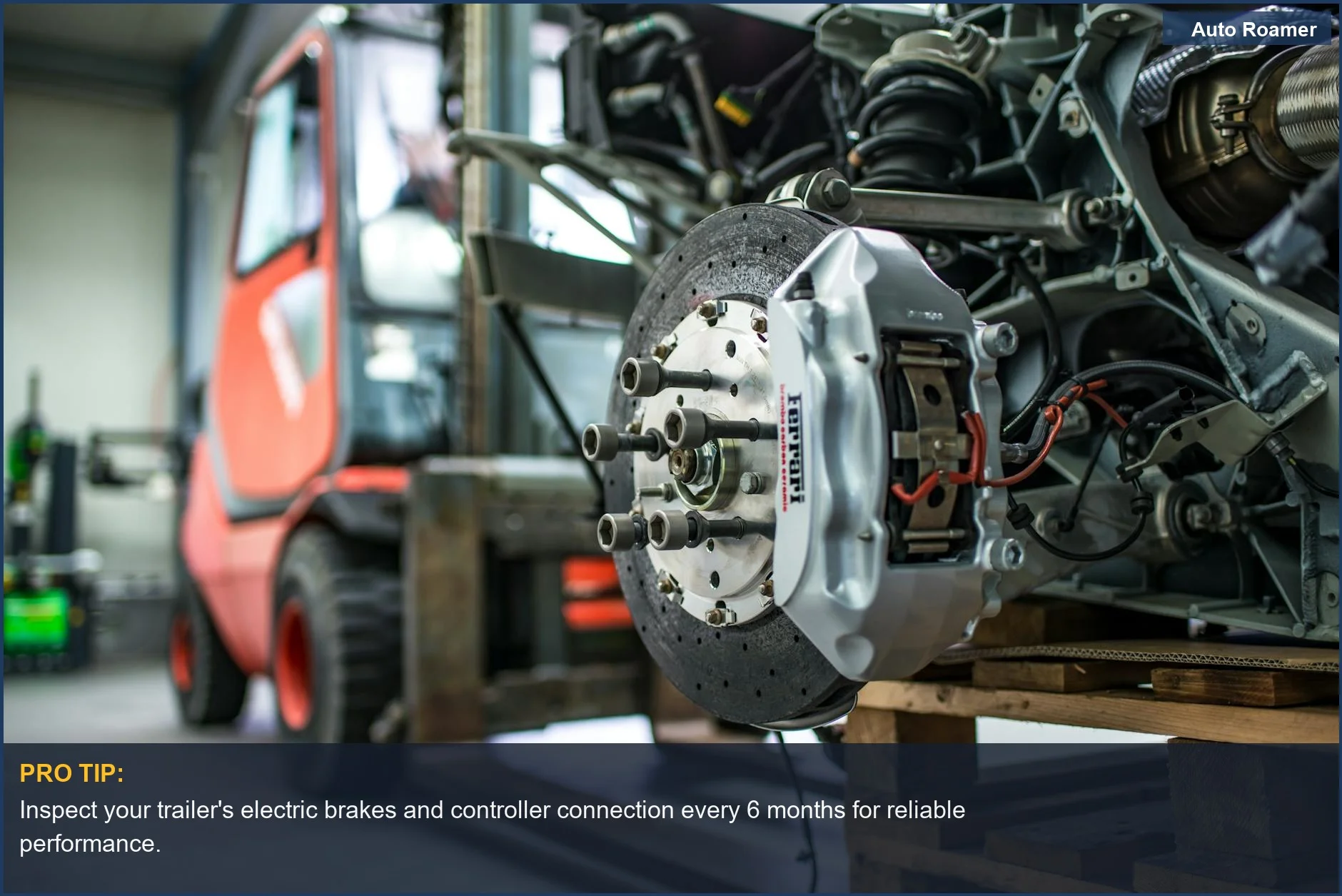 Detailed automotive brake caliper and disc in an industrial workshop, essential for towing safety.