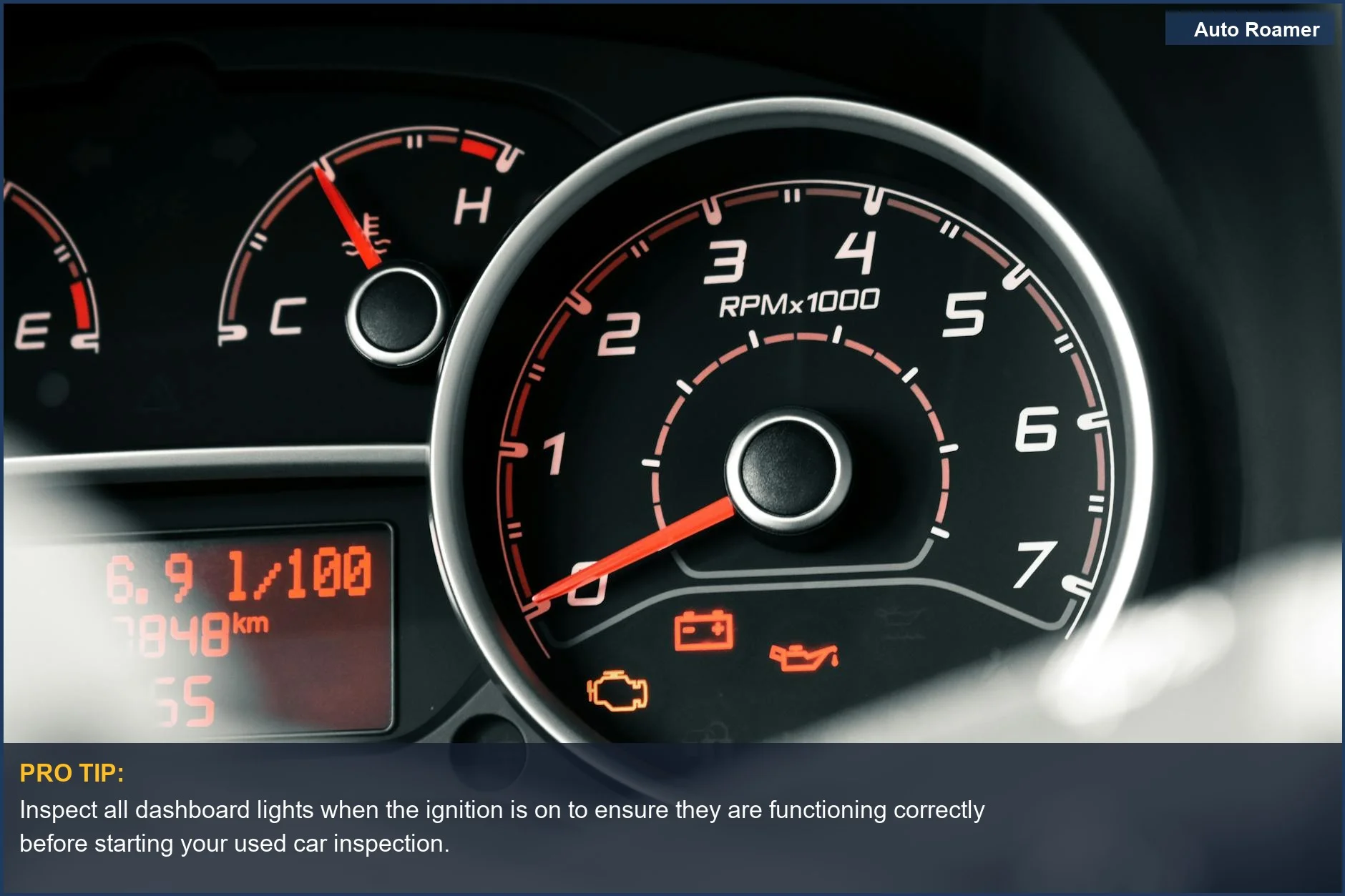 Close-up of a car dashboard with tachometer and indicators, illustrating car diagnostics for used vehicles.