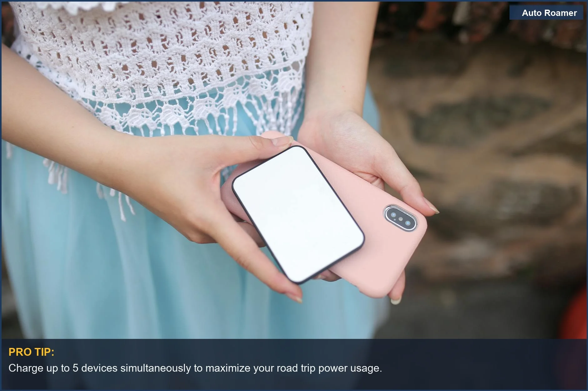 Woman holds smartphone and power bank, demonstrating portable power station capabilities for charging on the go.