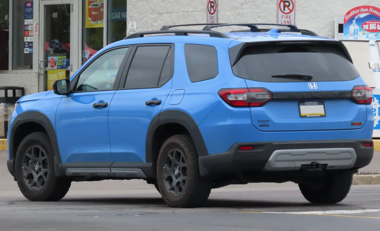 Blue Honda Pilot TrailSport, current fourth generation, front-side view.