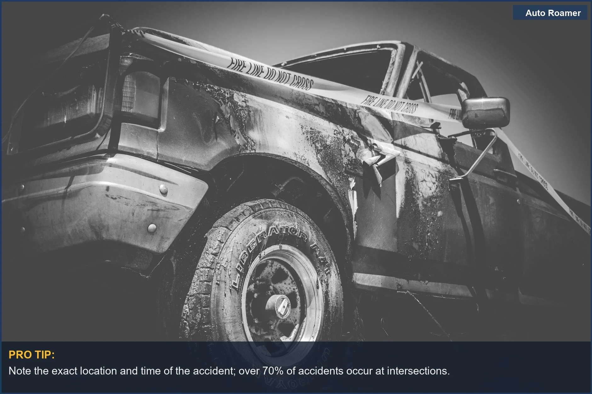 Dramatic black and white image of a damaged truck with police tape after a significant accident.