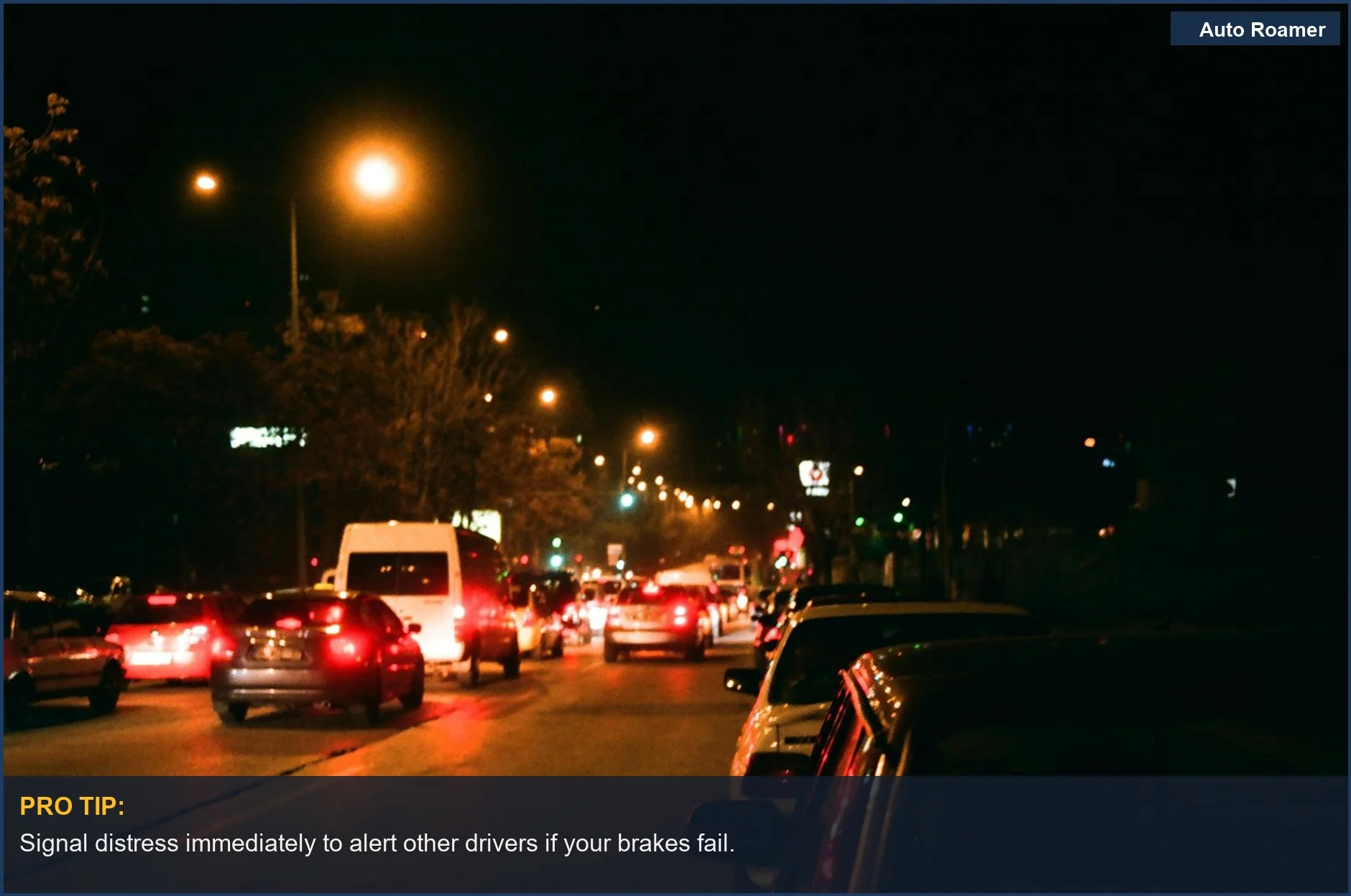 Brightly lit urban street at night showcasing driving conditions that can lead to brake failure.