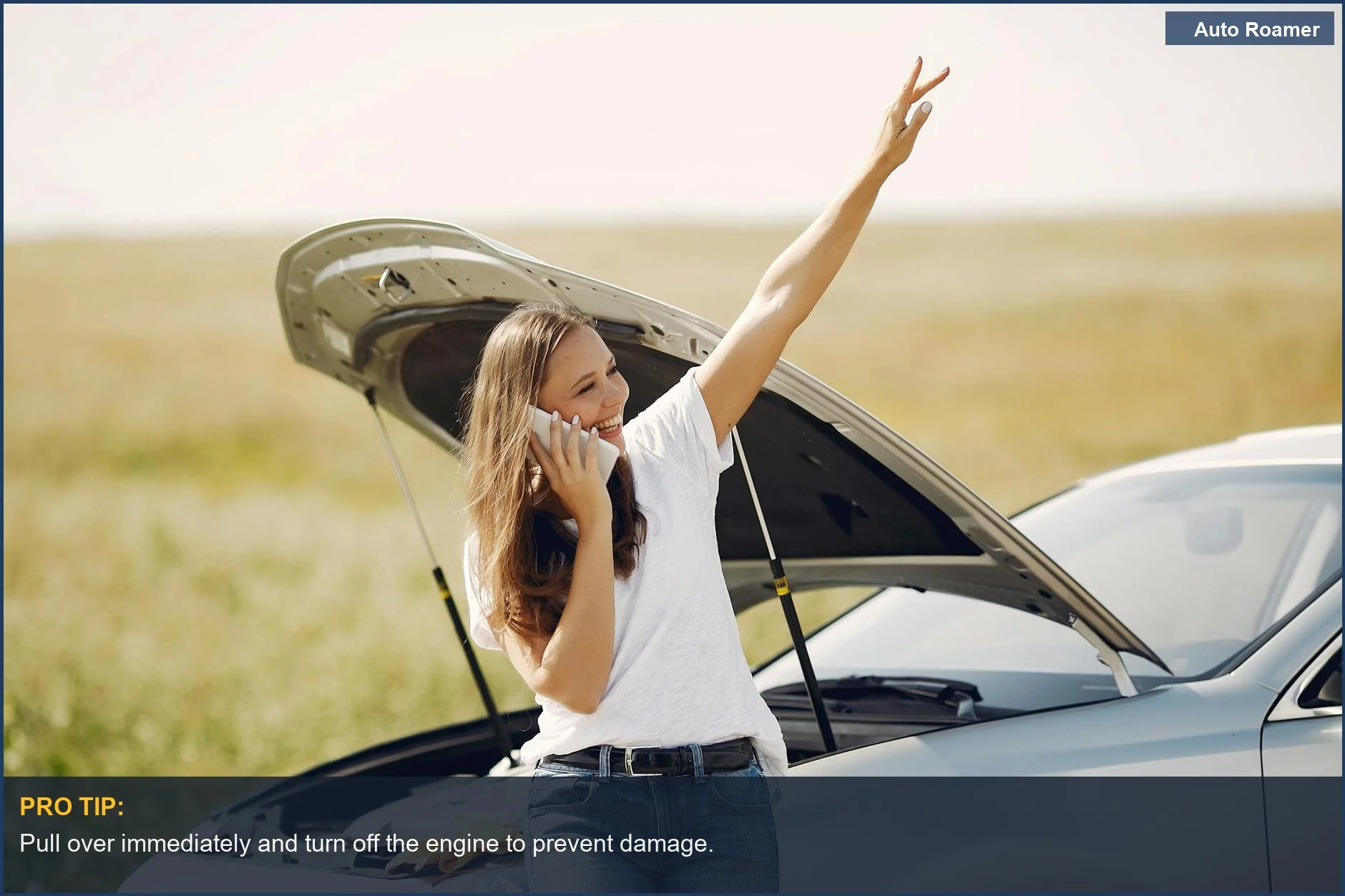 Young female driver smiling while on the phone next to her overheating car hood--car overheating what to do