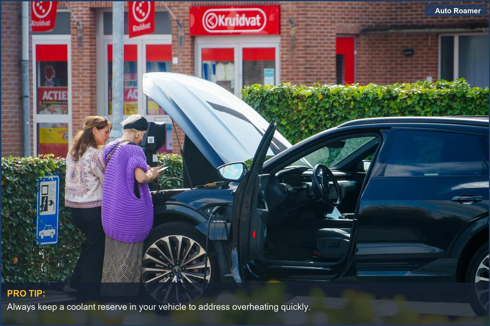 Two women checking their car's engine with an open hood--how to handle overheating vehicle