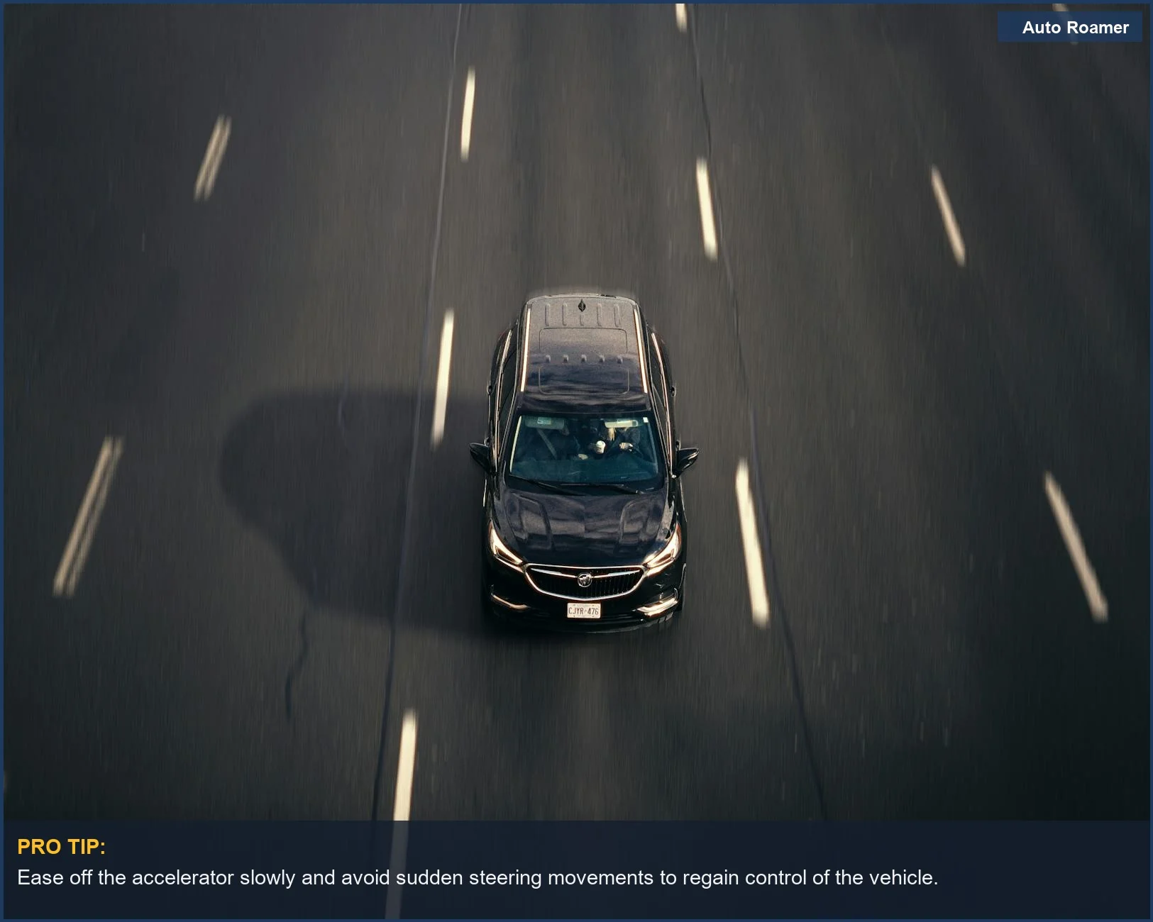 Aerial view of a black car on a busy Toronto highway, depicting urban travel and potential hazards.
