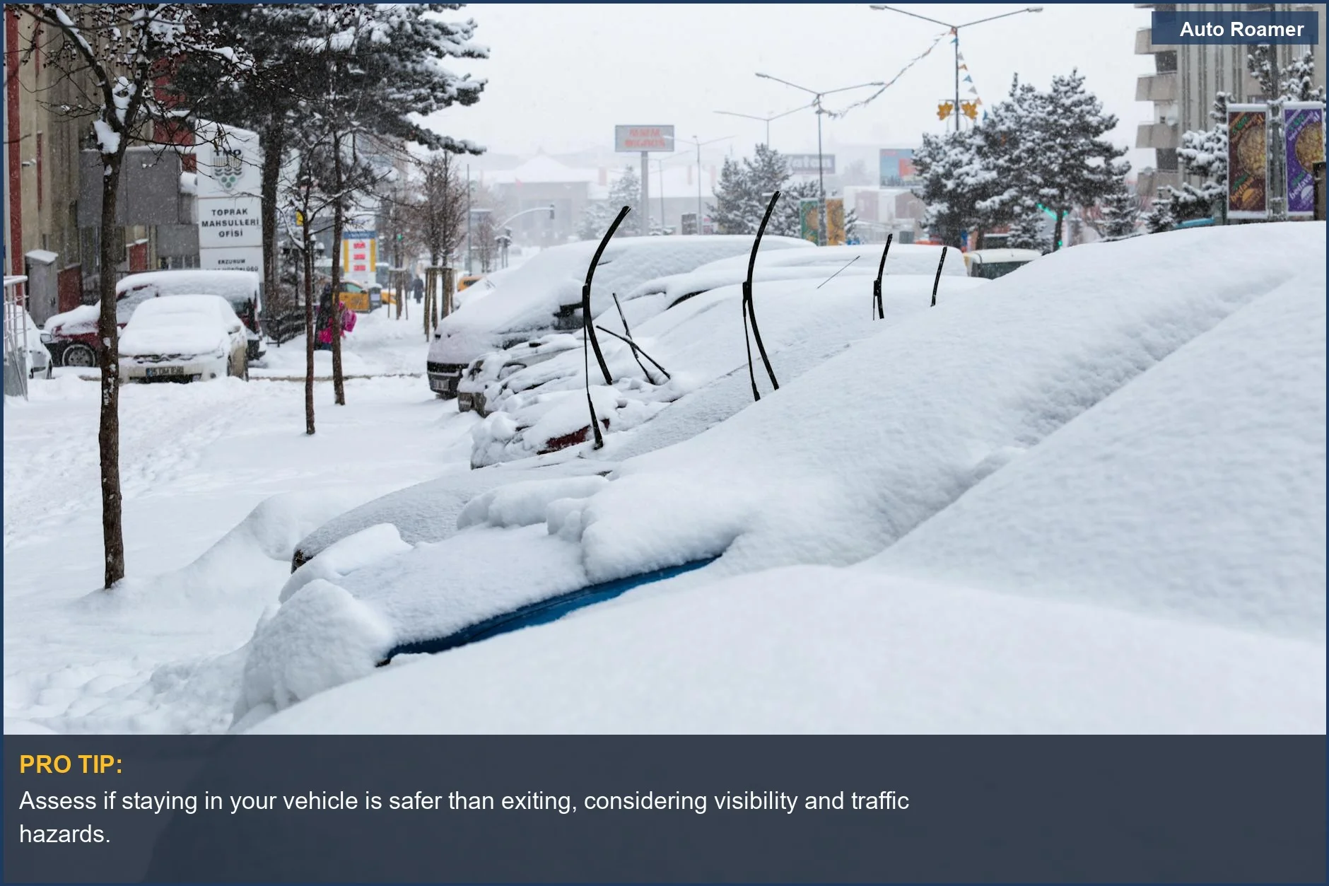 Car slid off road into a snowy ditch during a winter blizzard, highlighting dangerous conditions.