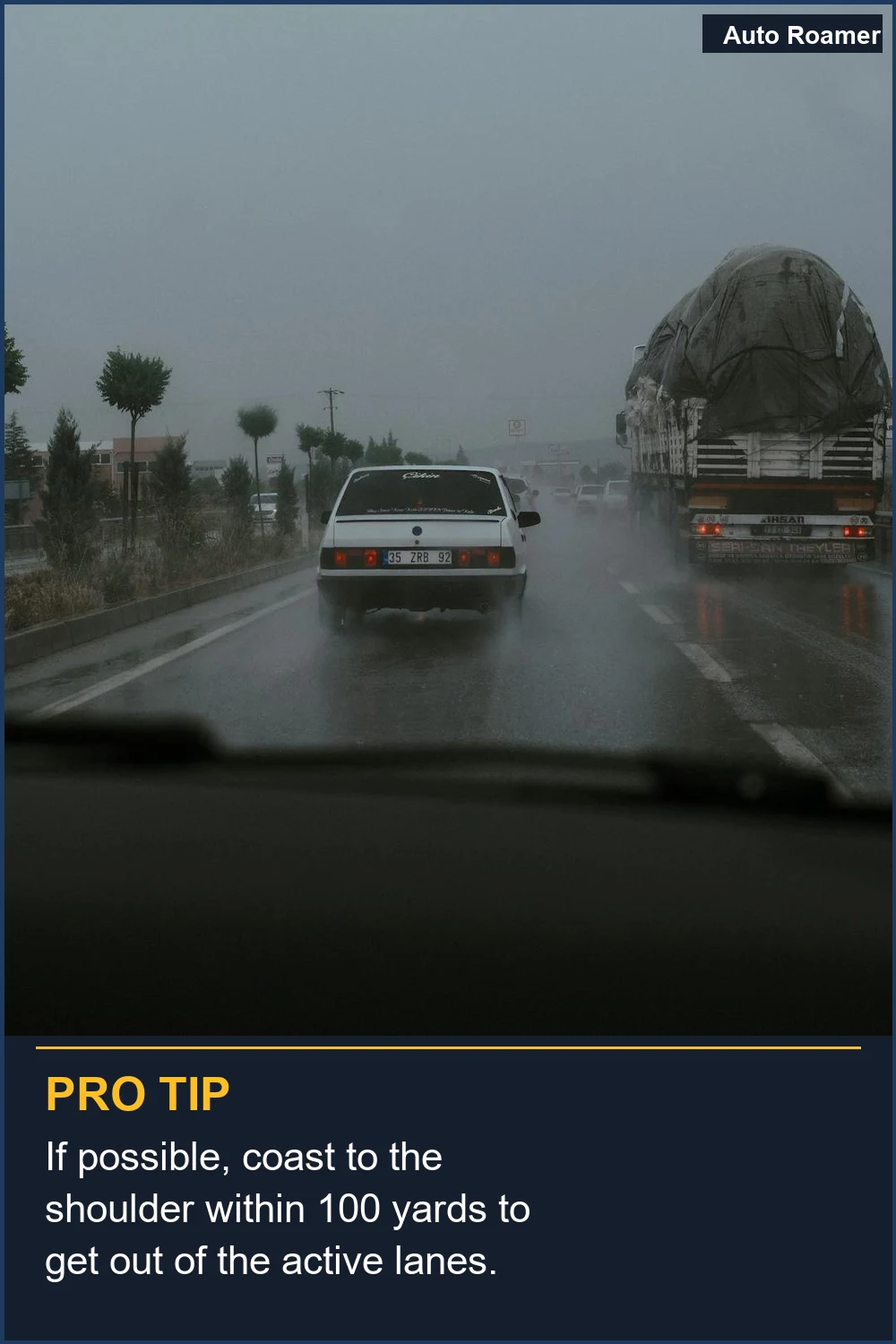 If possible, coast to the shoulder within 100 yards to get out of the active lanes.