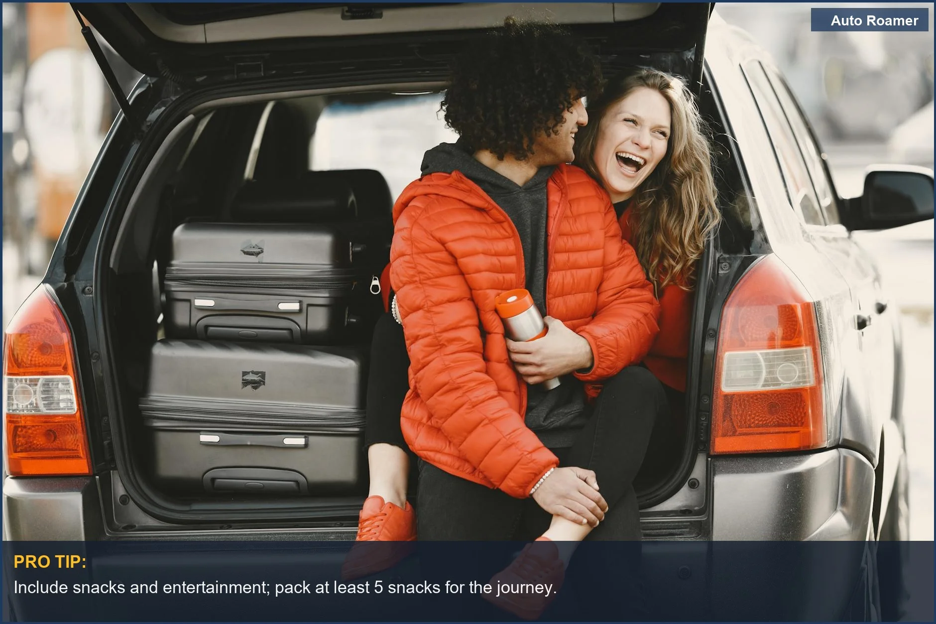 Joyful couple in the trunk of their car, surrounded by packed suitcases, ready for adventure.