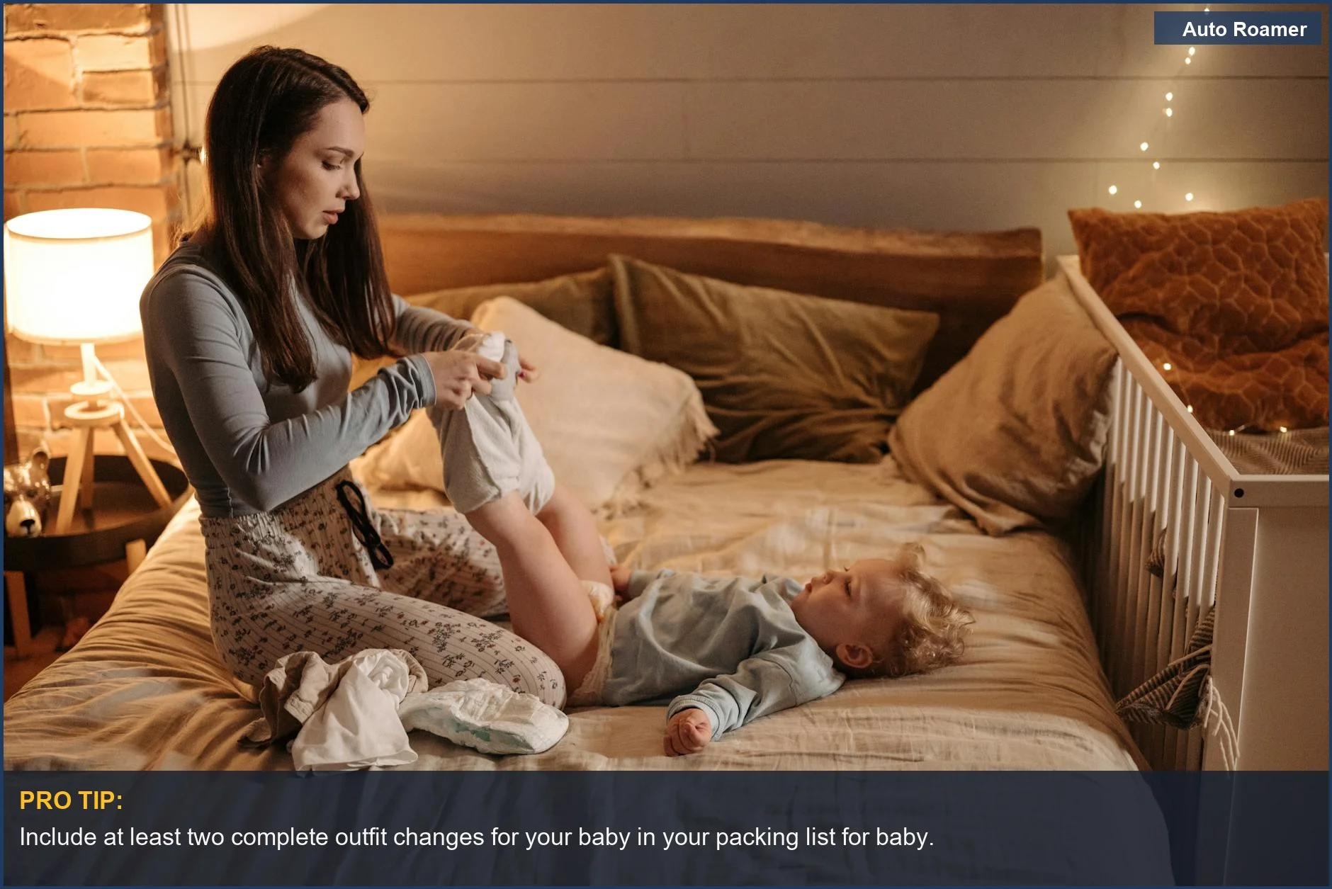 Mother lovingly changing baby's outfit in a cozy bedroom, highlighting smart packing for baby travel.