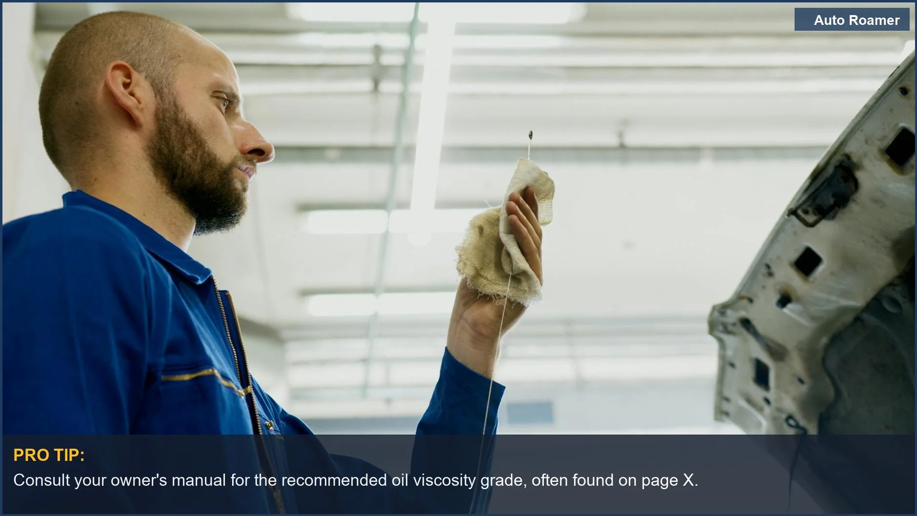 Mechanic checks car oil level with a dipstick, demonstrating how to find the right car oil viscosity for your vehicle.