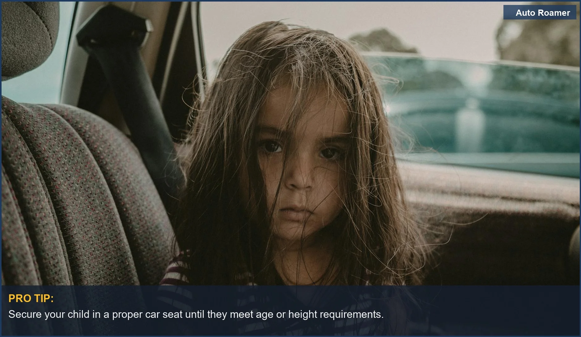 A young girl in a car seat, illustrating the significance of child front seat age regulations.