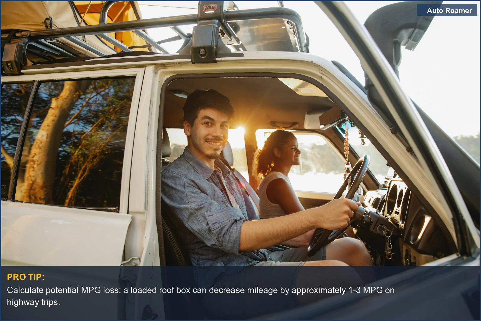 Campers enjoying sunset with tent on car roof, exploring roof box impact on gas mileage.
