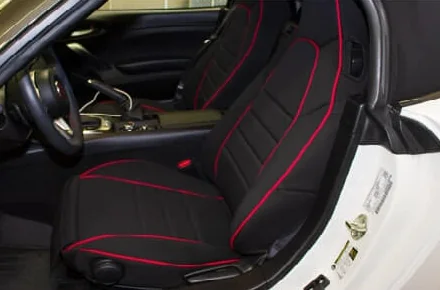 Fitted car seat cover shielding a back seat from messes and stains