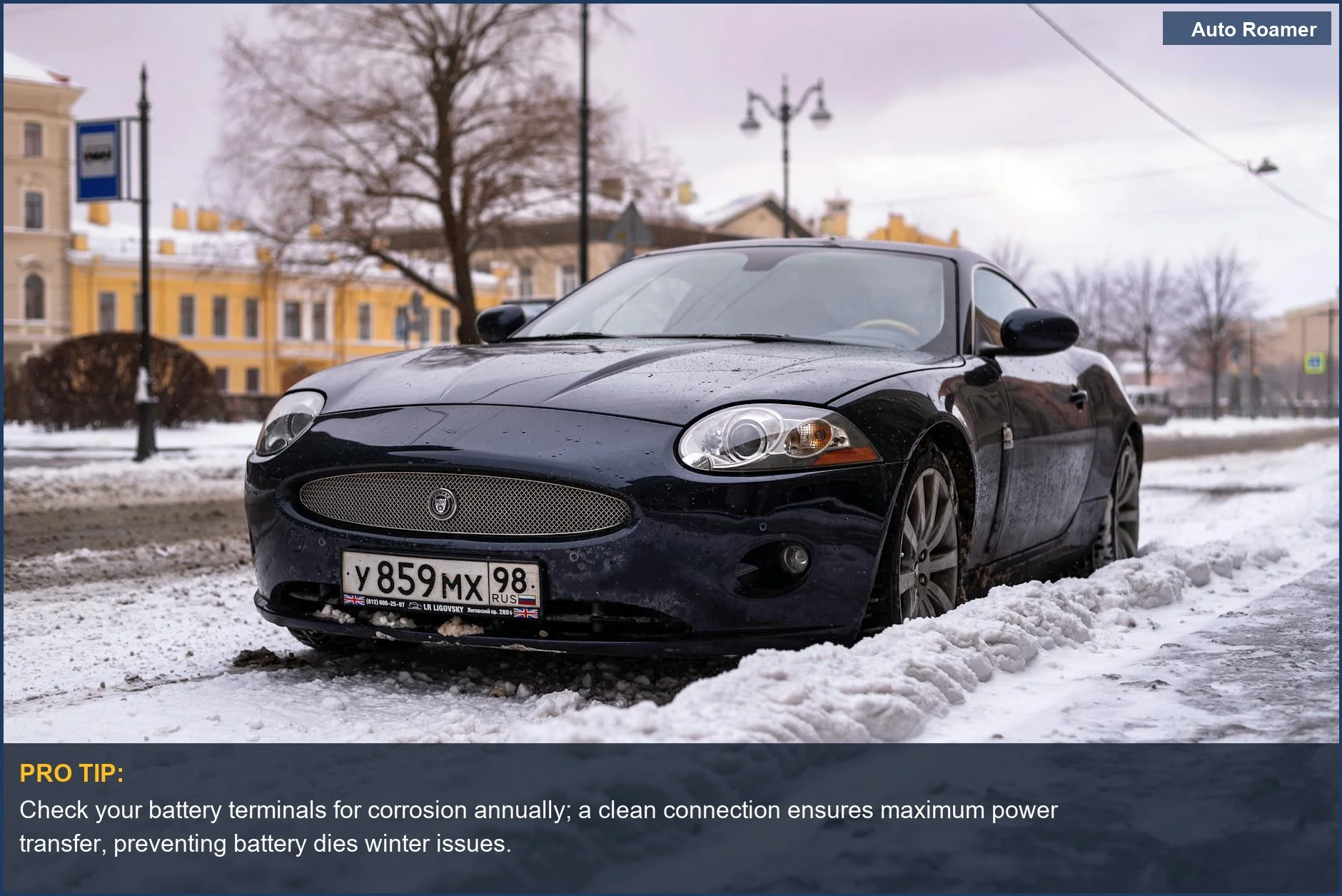 Luxury car parked on snowy city street, illustrating winter battery failures.