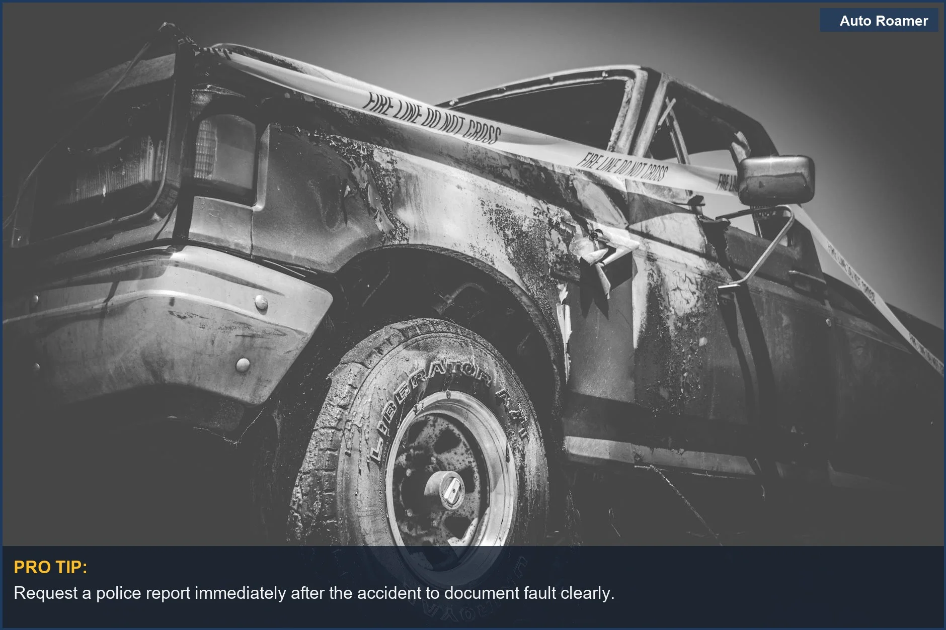 Dramatic black and white photo of a crashed truck with police tape, illustrating insurance rate increase not at fault.