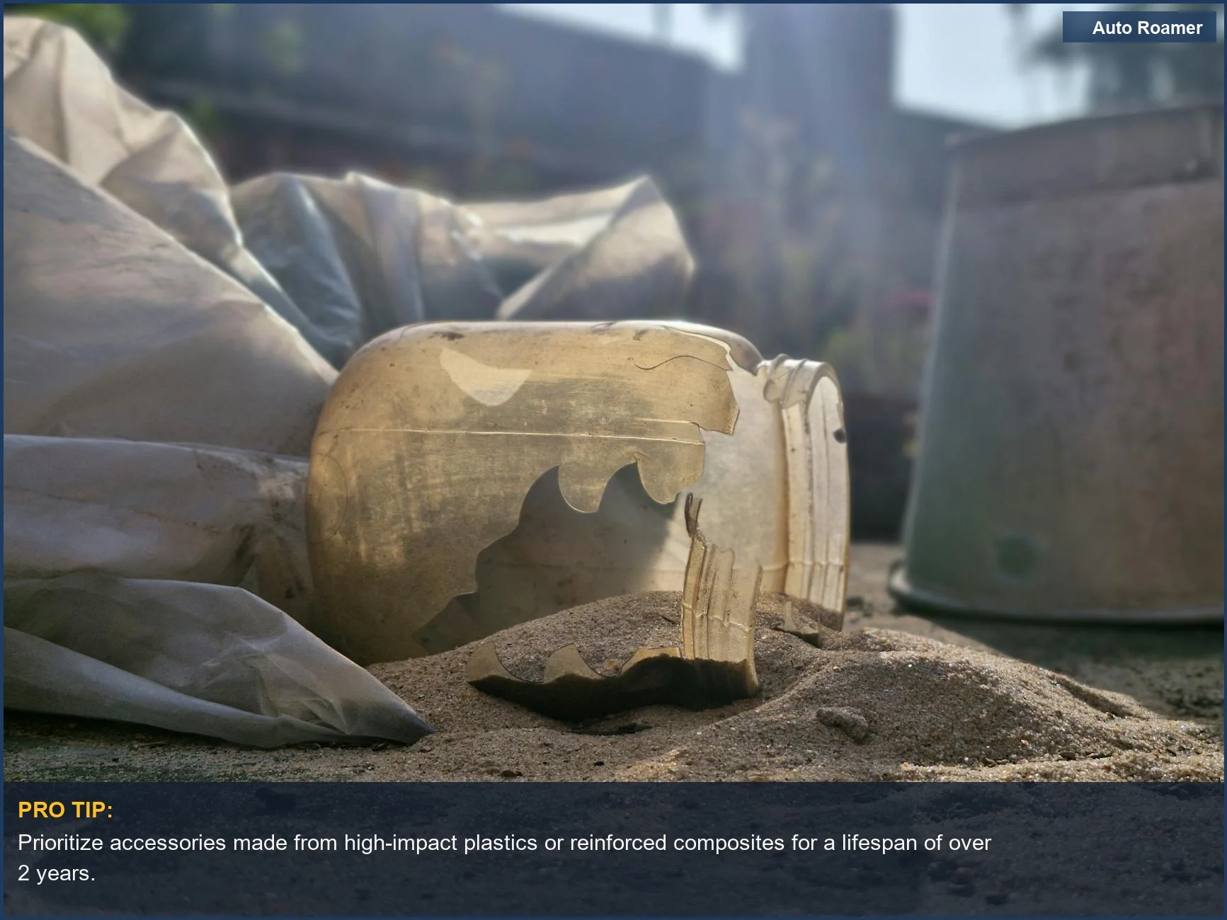 Broken plastic debris scattered on sand, representing urban waste and the short lifespan of cheap car accessories.