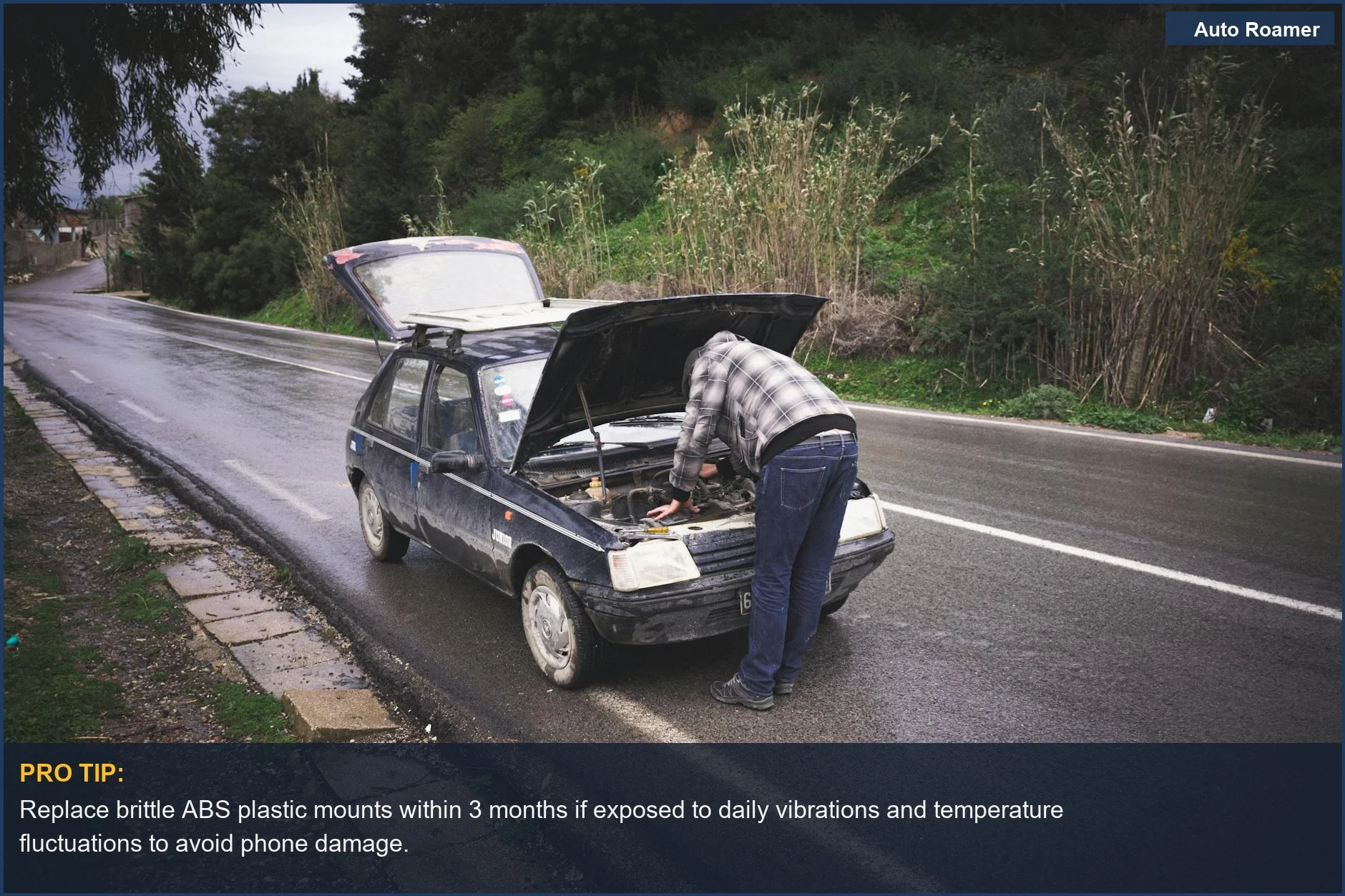 Individual repairing car on rainy road, showing urgent need for durable car accessories.