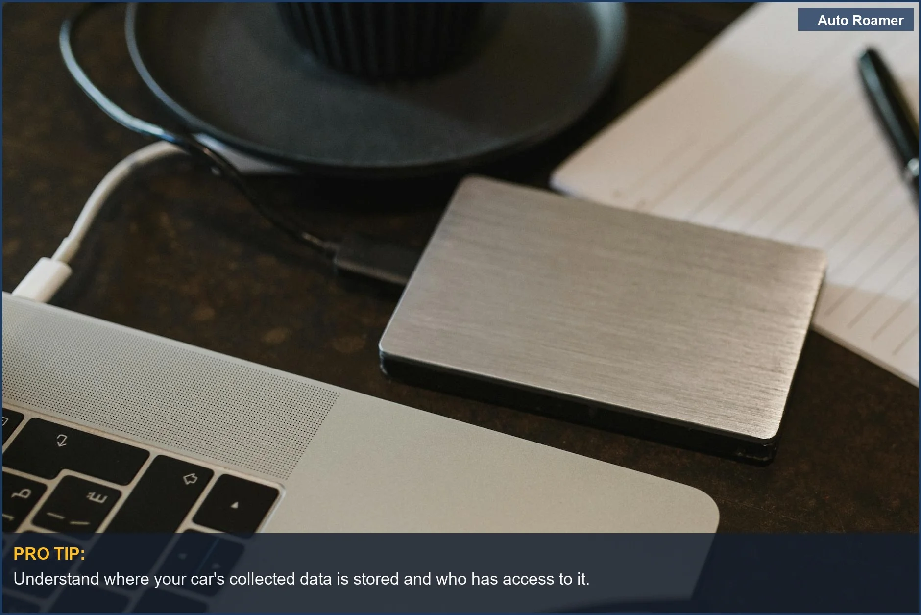 Laptop connected to an external hard drive, representing car data collection and storage.